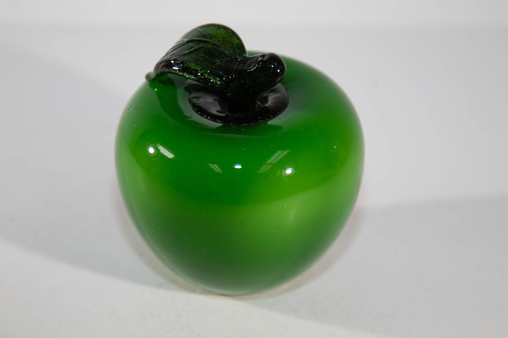 Vintage Murano Blown Glass Bright Green Apple with Green Stem Paperweight.
Beautiful blown glass apple in such a gorgeous vibrant emerald green.
Delightful figurative art glass out of Murano Italy.
This piece has a brilliant coloring and