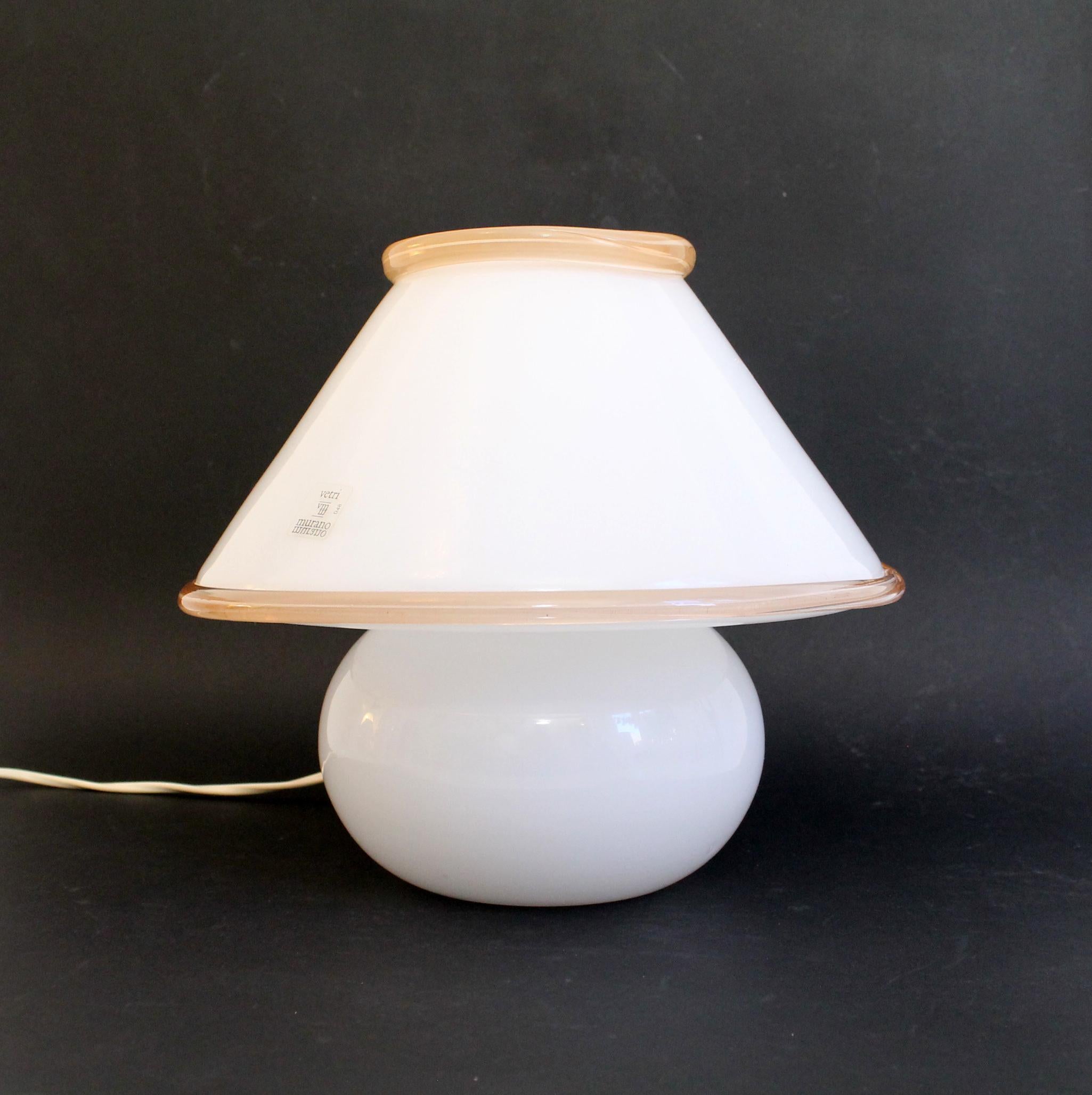 Murano vintage mushroom table/desk lamp by LEUCOS. White opaline glass with light pink glass mass insertions
The original sticker (Murano manufacturer number #0048 LEUCOS) is still on it!
1970s original hand blown glass
Technique: made of a