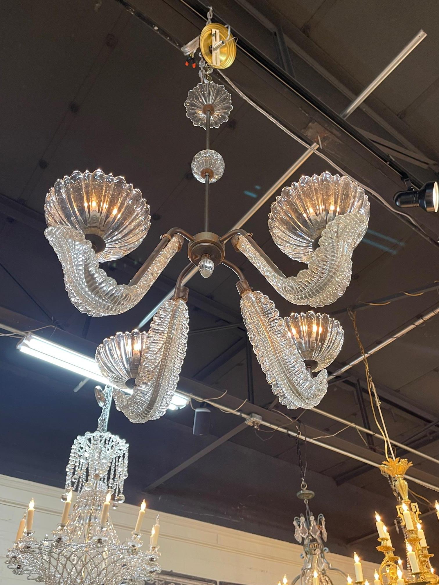 Vintage Italian Murano glass and brass 4 light chandelier after Barrovier, Circa 1960. The chandelier has been professionally re-wired, cleaned and is ready to hang. Includes matching chain and canopy.
  