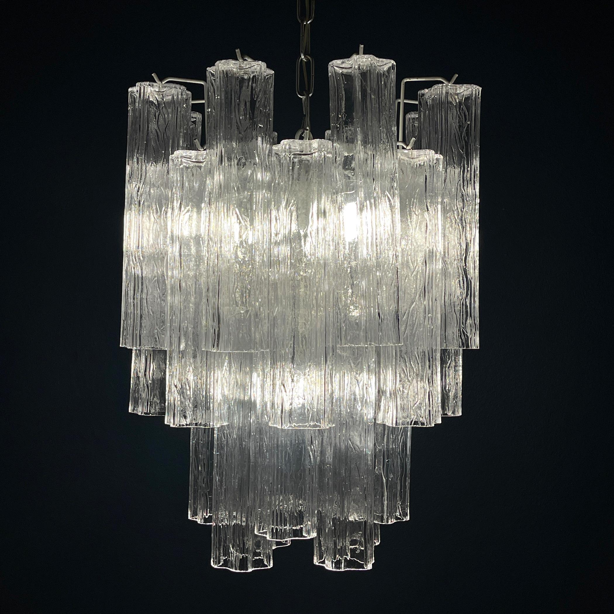 Indulge in the timeless elegance of this Murano glass chandelier, crafted in Italy during the 1960s by renowned designer Toni Zuccheri for Venini & Co. Venini & Co. stands as a beacon of innovation within Italy’s esteemed glassmaking tradition.