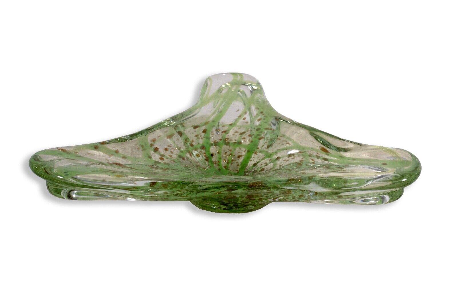 A stunning vintage Murano art glass bowl. Freeform shape in clear and green glass with a gold speckled design. An earth-toned accent perfect for a modern designed space. From a private collection. Dimensions: 2.5”h x 11”w x 9”d. In very good vintage