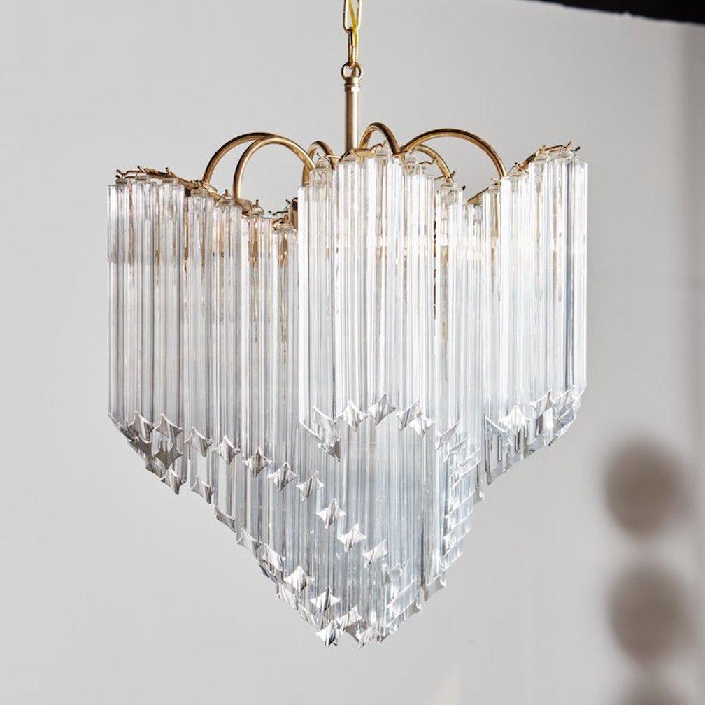A gorgeous Venini style chandelier featuring 110 hand blown Murano glass prisms hanging from a beautiful brass frame. Italy, 1970s. 

DIMENSIONS: 22” Dia x 26” H, 47” OAH to canopy, each crystal is 11” long and 1” thick, 5.5” Dia canopy.