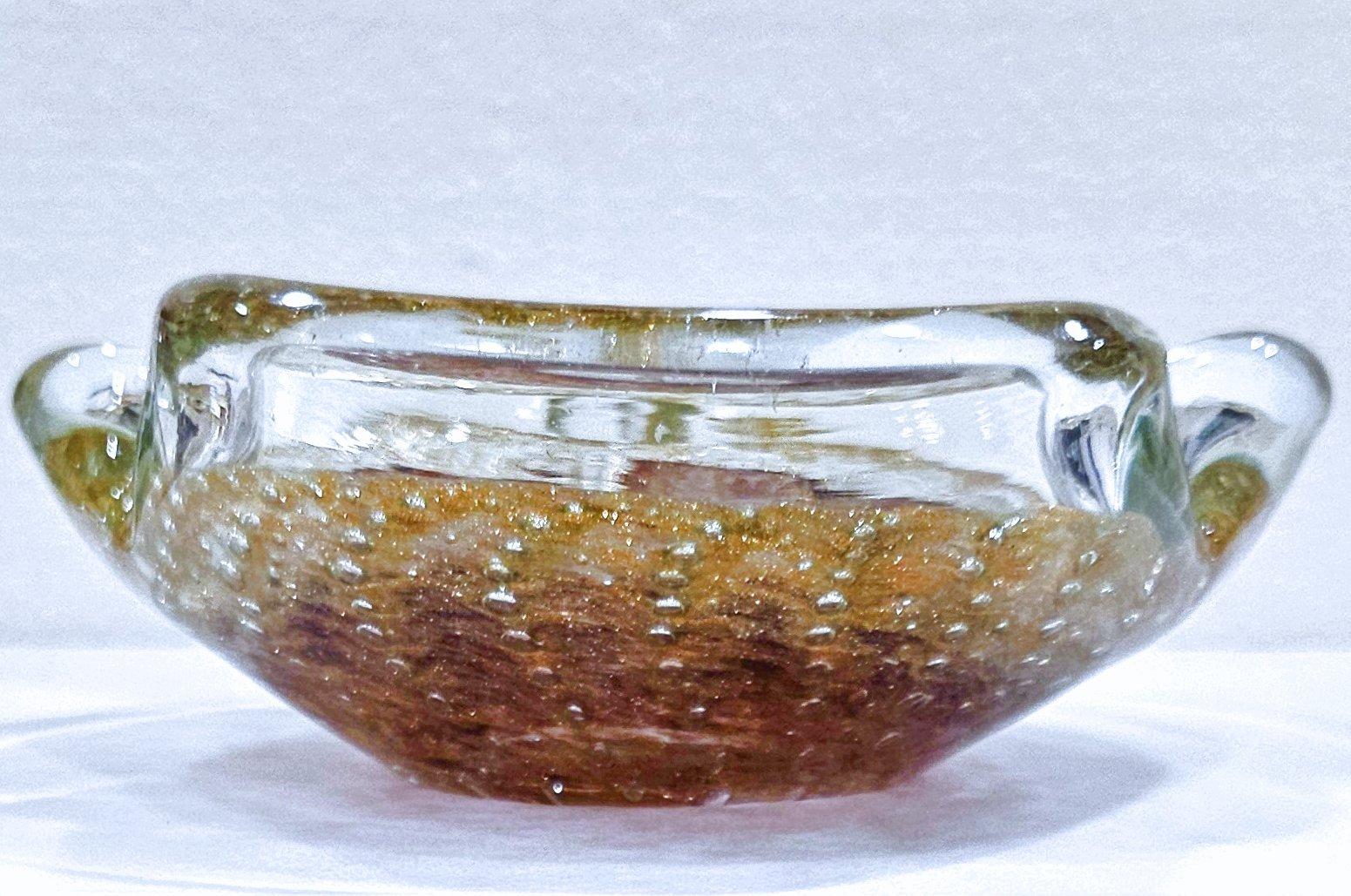 Vintage Murano Glass Ashtray/Dish, Bullicante (controlled bubbles) & Aventurine
If you like shimmer, you'll love this piece with its generous aventurine, inside which is a nice, subtle pattern of controlled bubbles.
Measures: approximately 7 x 2 