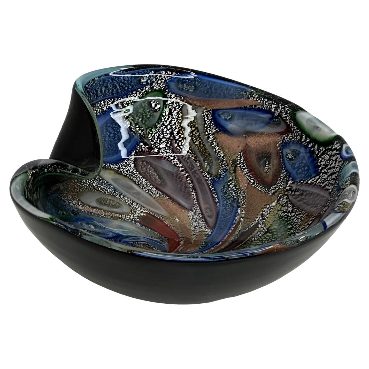 Gorgeous hand blown Murano art glass piece with Sommerso and bullicante techniques featuring abstract polychrome designs throughout the bowl. A beautiful organic shaped bowl, catchall or centre piece, Venice, Murano, Italy, 1960s. Found at an estate