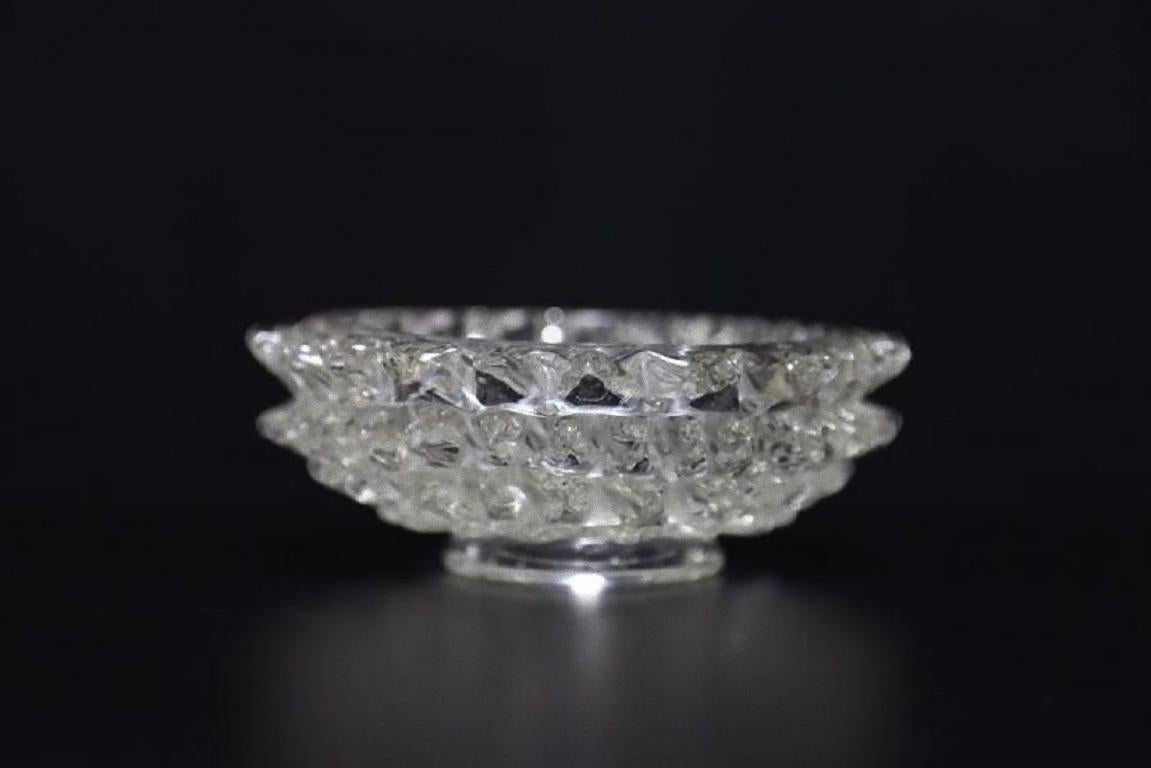 This is a shining glass bowl realized by Ercole Barovier in the 1940s.

Elegant clear glass bowl. In excellent conditions.

Dimensions: cm 15 x 5 x 15. 

Ercole Barovier (1889-1974) was the son of Benvenuto Barovier. At the age of 30, he