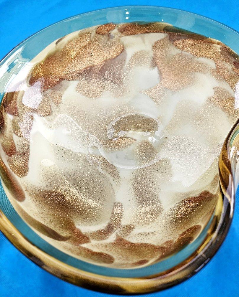 Vintage Murano Glass Bowl / Vide-Poche with Copper Aventurine.
UPDATE: Due to agreement with 1stDibs, we'll be staying through the end of the year.
Good vintage condition. We found no chips or cracks. 
It measures approximately 7.25 x 6.25 x 2