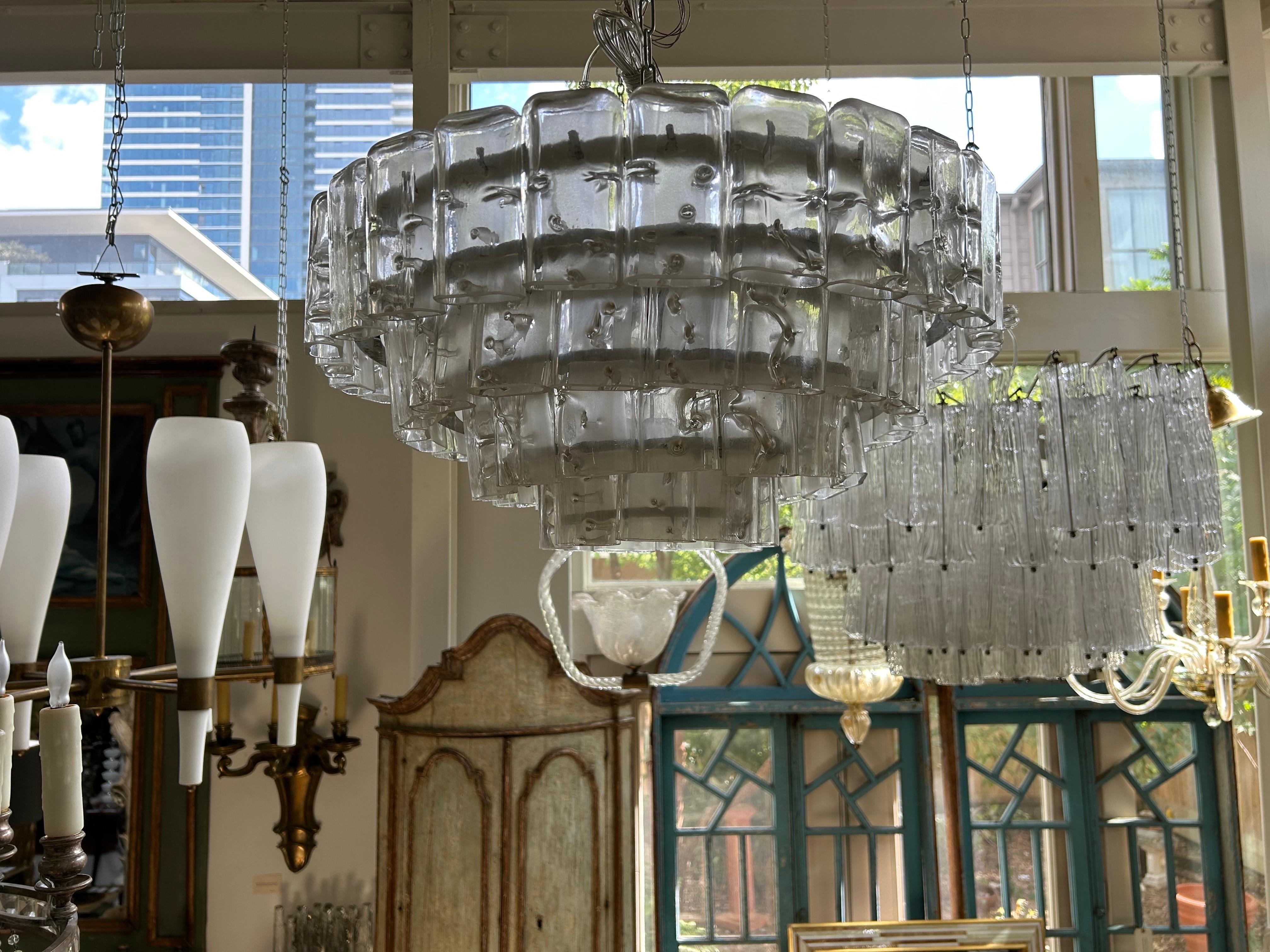 Vintage Murano glass chandelier by Carlo Nason For Mazzega.
This stunning Mid-Century Modern four tier Murano chandelier is perfect for older homes with lower ceiling heights or can be suspended from the appropriate amount of chain for higher