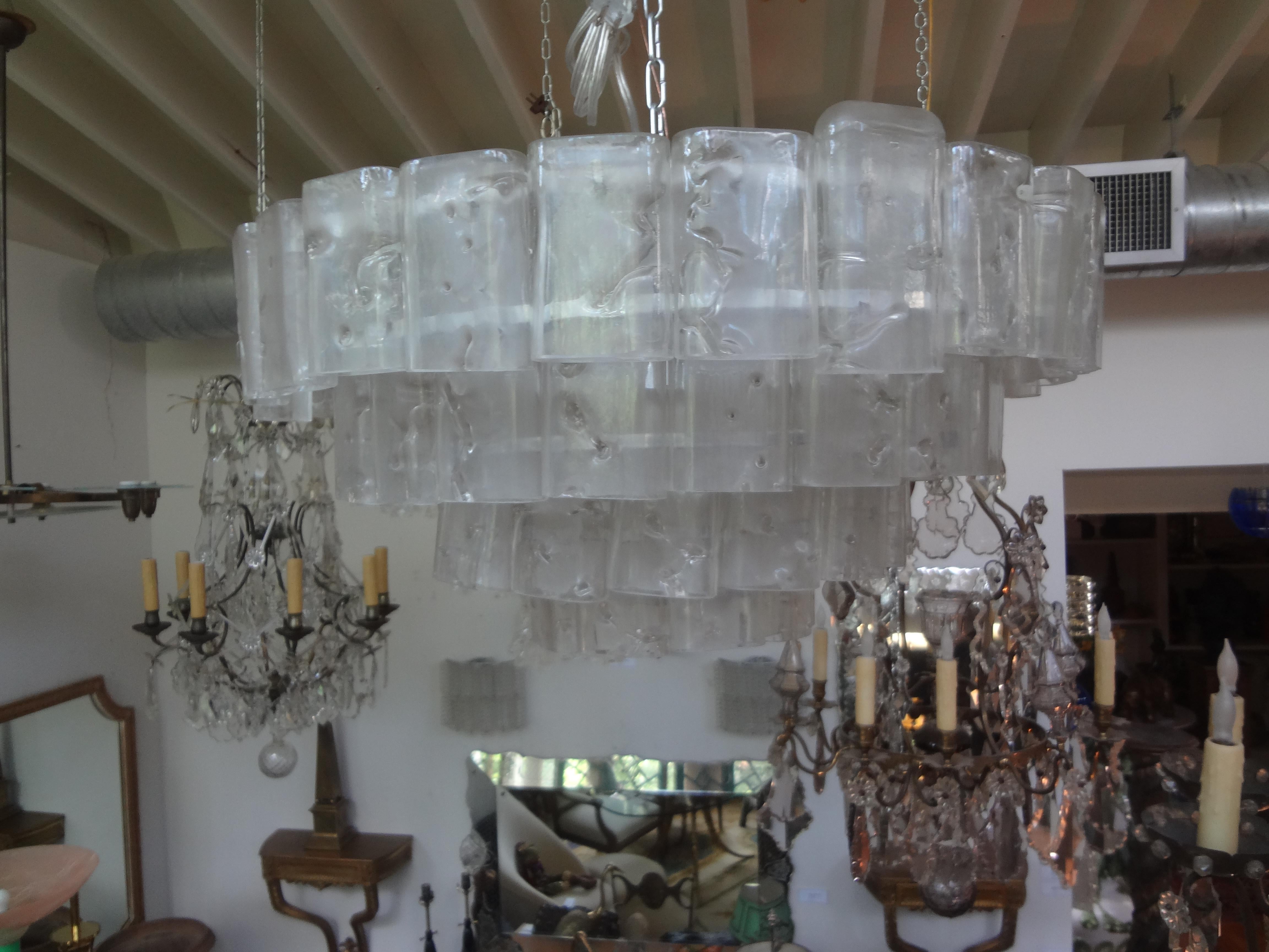 Vintage Murano glass chandelier by Carlo Nason For Mazzega.
This stunning Mid-Century Modern four tier Murano chandelier is perfect for older homes with lower ceiling heights or can be suspended from the appropriate amount of chain for higher