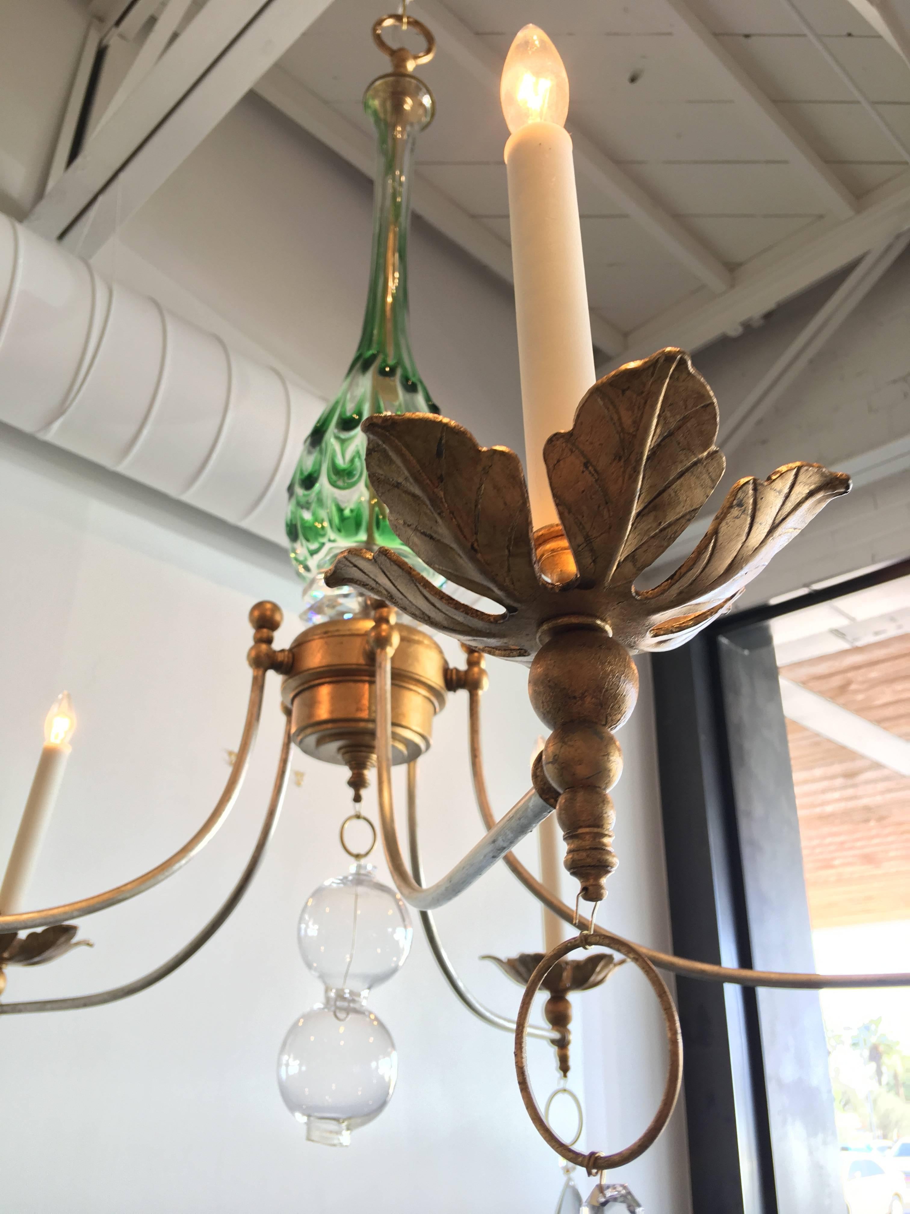 This amazing fixture has been created around a vintage green swirled Murano glass centerpiece. The arms and body are contemporary and new. How fabulous would this be in your home?!