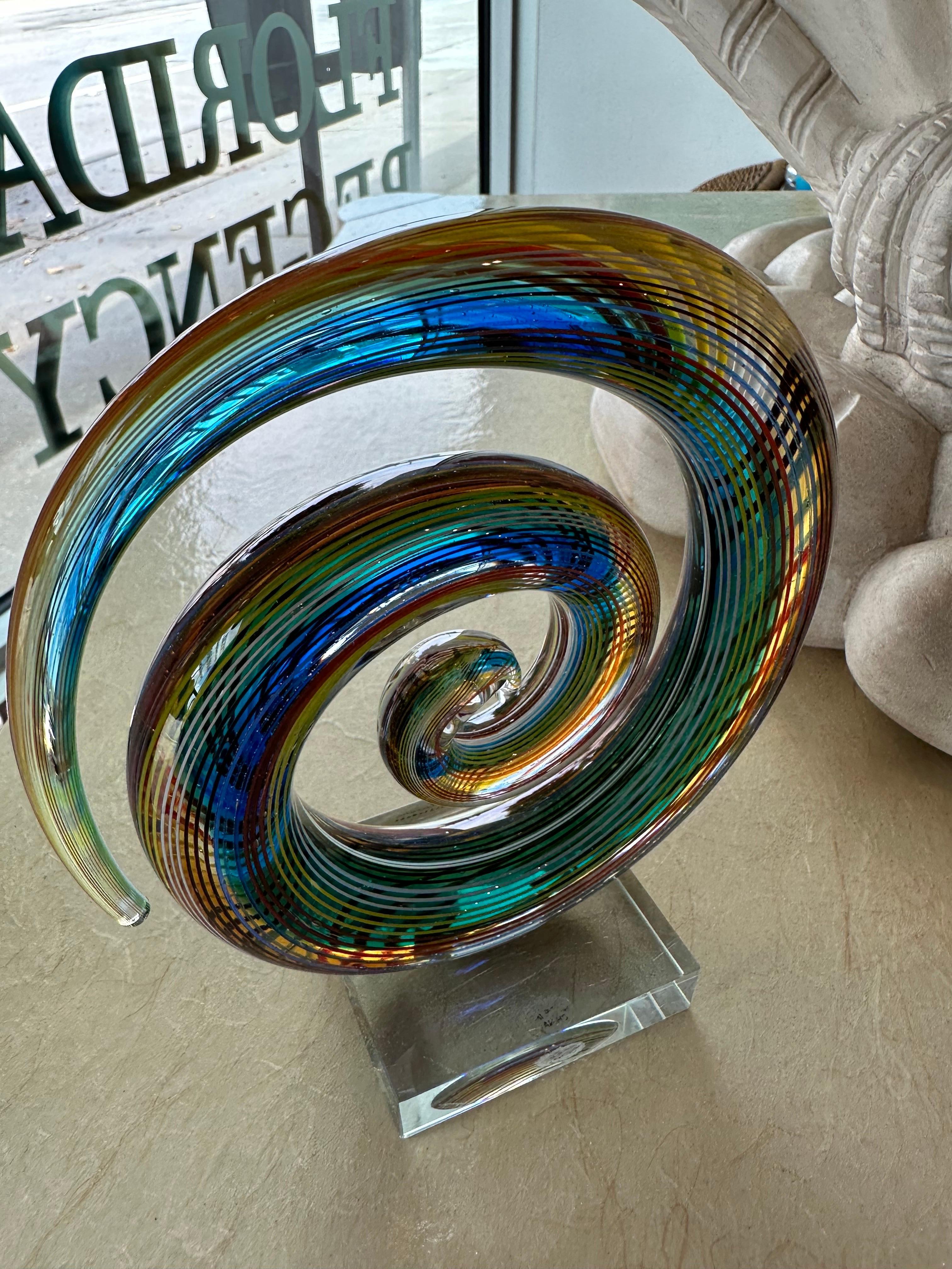 Lovely vintage colorful rainbow glass art sculpture mounted on lucite. Marked Murano. No chips or breaks. Dimensions 8 H x 6.5 W x 3 D.