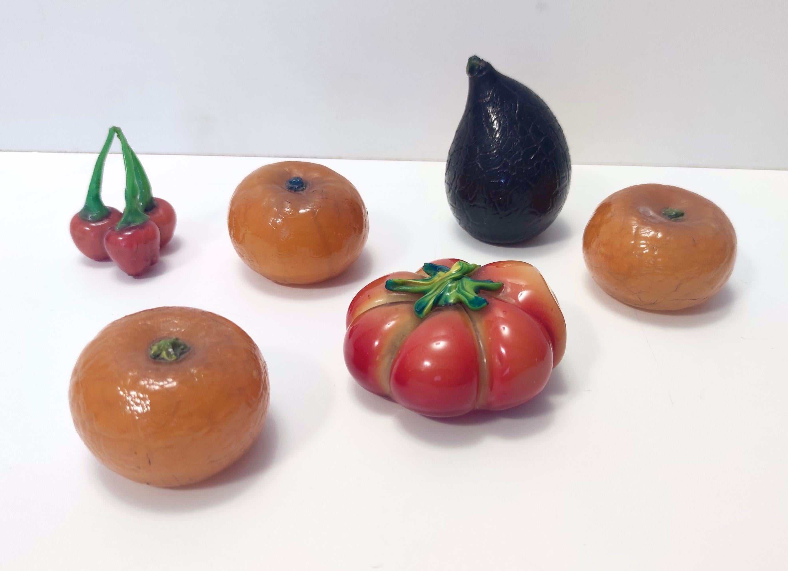 Made in Italy, 1930s.
These tangerines are made by Napoleone Martinuzzi for Venini in Murano glass. 
These items might show slight traces of use since they are vintage as a chip on the top of one fruit, but it can be considered as in good original