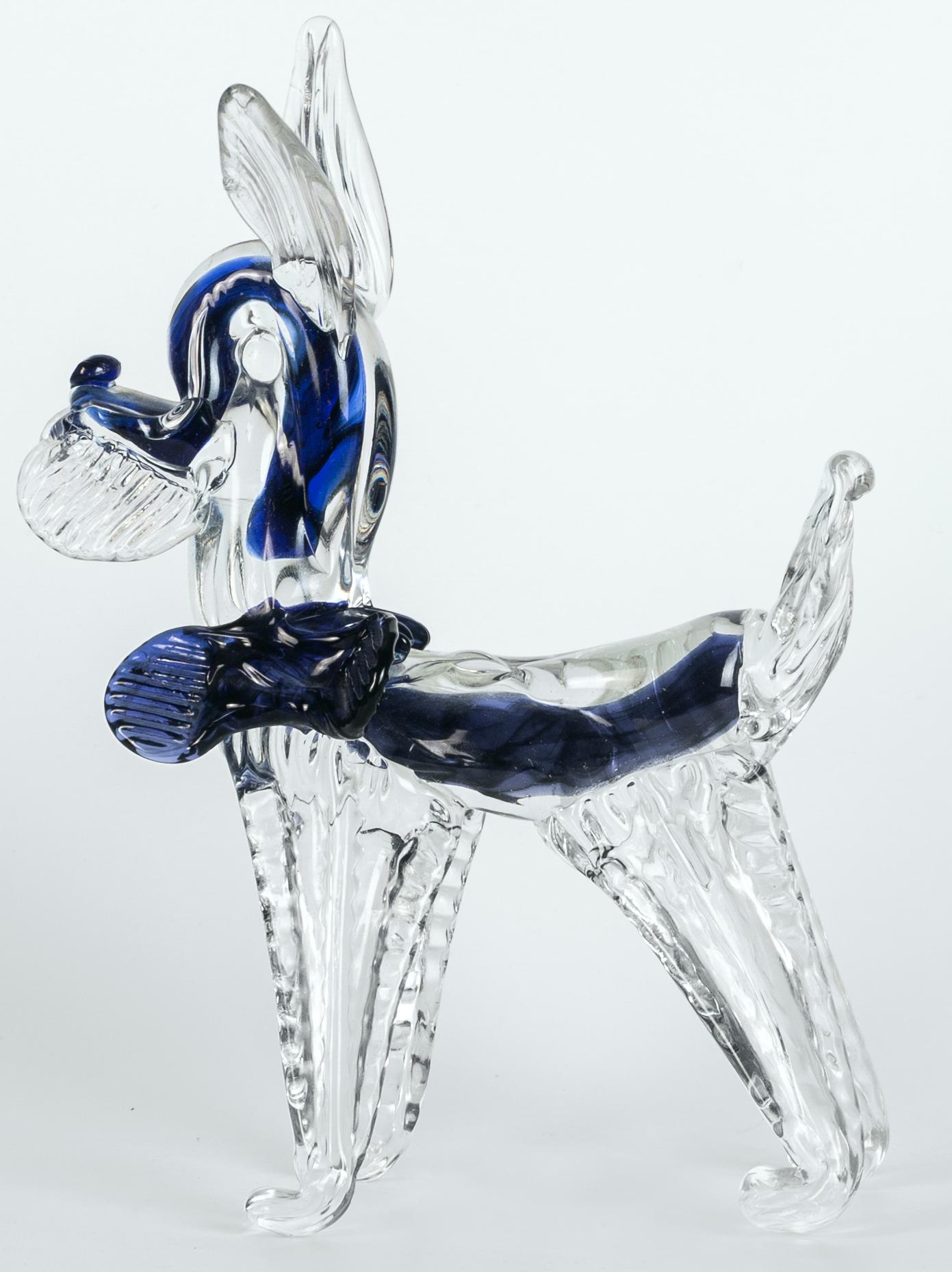 Murano glass dog is a beautiful glass decorative object, realized by Murano manufacture during the 1980s. 

This object belongs to the exclusive and nice collection of Murano glass animals made through a processing technique called 
