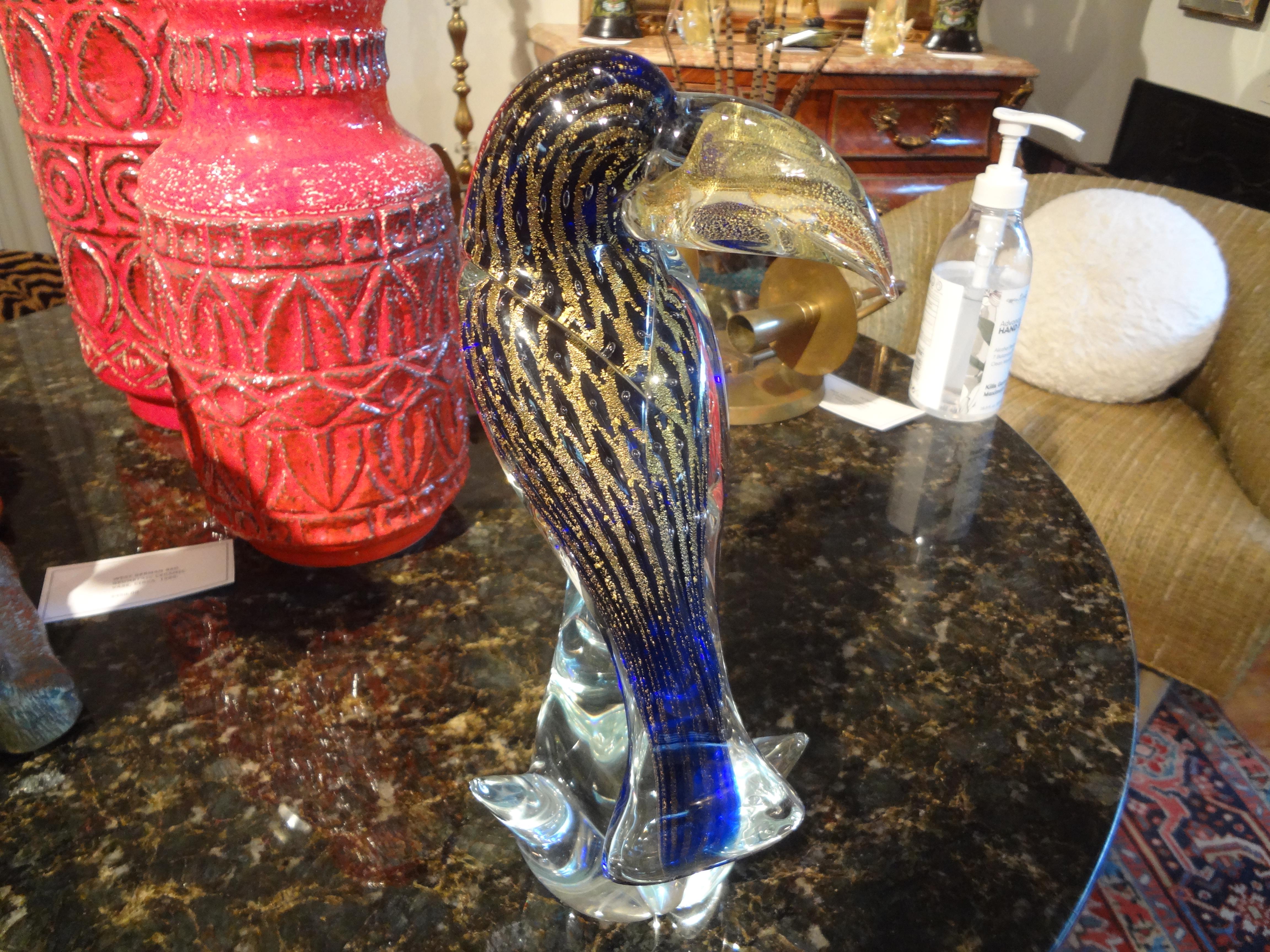 Vintage Murano glass figure of a Toucan.
Gorgeous 20th century hand blown Murano glass figure of a toucan. This beautiful finely detailed Murano toucan bird is executed in a gorgeous cobalt blue filled with gold. Unsigned but clearly by a master