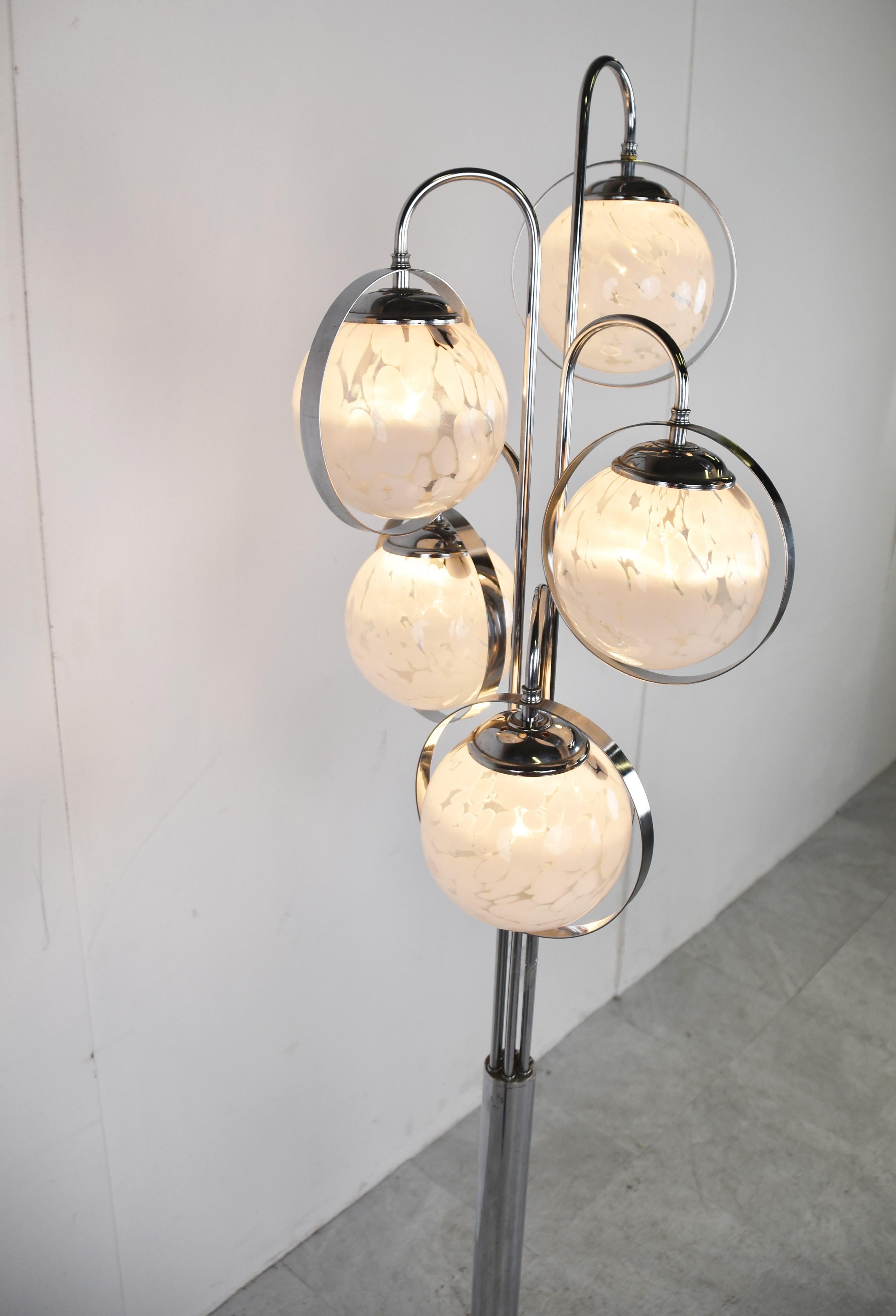 Vintage chrome floor lamp with 5 murano glass globes.

The lamp emits a nice soft light thanks to the stained glass globes .

Striking design with a timeless appeal. 

White marble base.

1970s - Italy

Dimensions:
Height:
