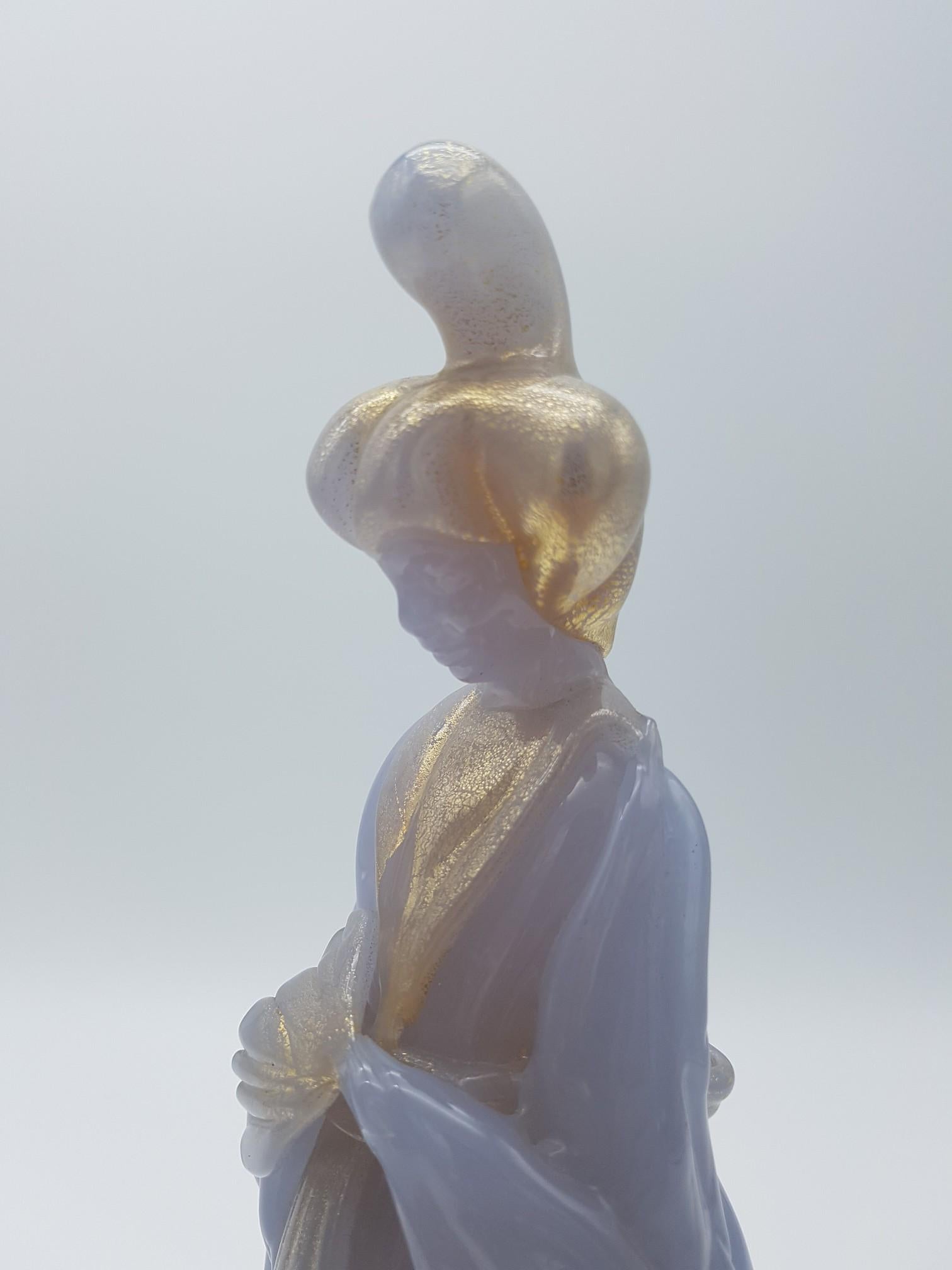 This vintage Murano glass figurine was handmade by the great glass-master Ermanno Nason at Gino Cenedese e Figlio glass factory in the late 1960s. The sculpture, all opaline lavender color, portrays a Japanese geisha and is a superb example of the