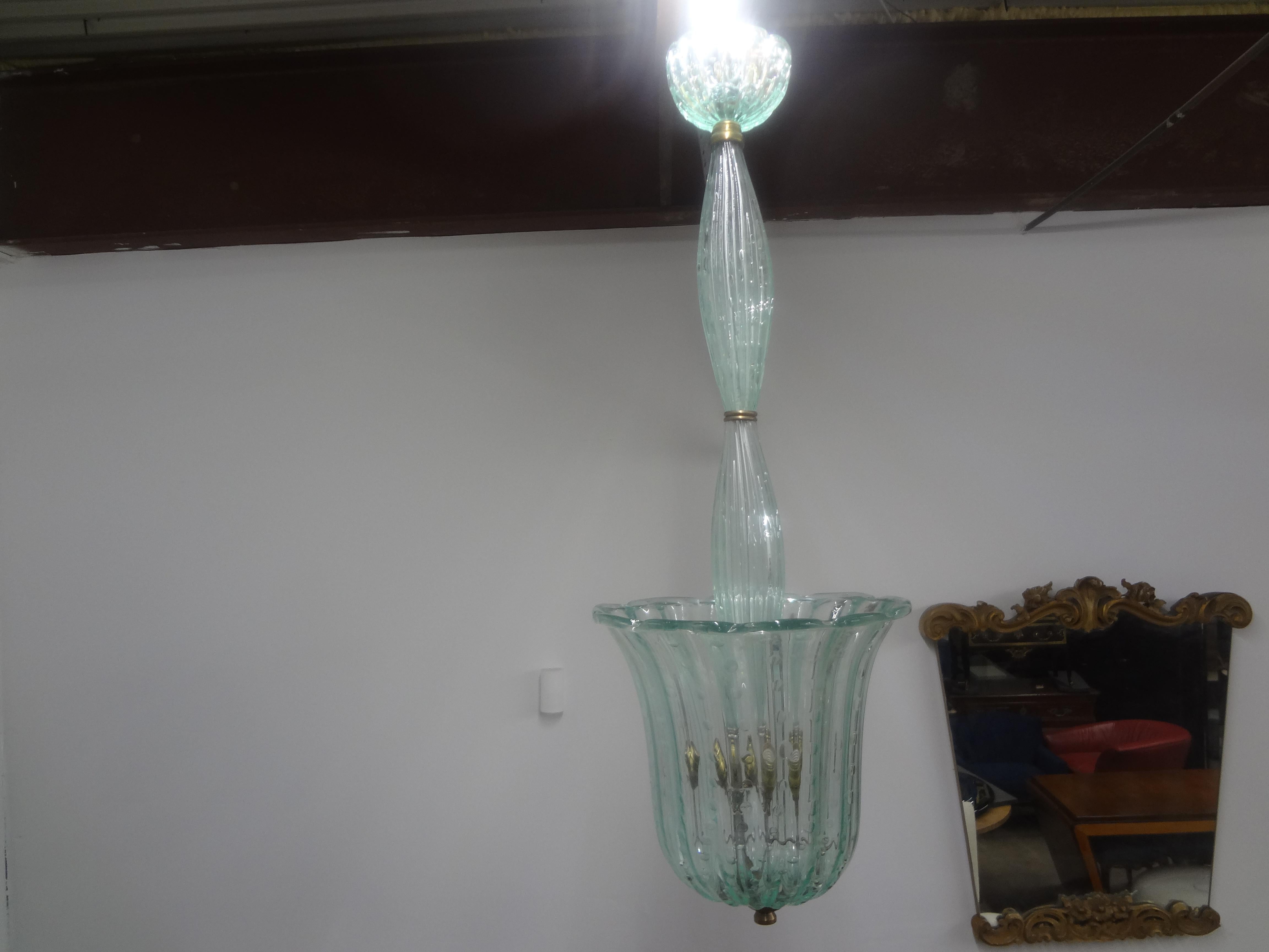 Vintage Murano Glass Lantern By Barovier & Toso.
This lovely mid century Murano glass lantern is made of a soft green blown glass with controlled bubbles accented with brass. 
This unusual Murano glass lantern has been newly wired for the U.S.