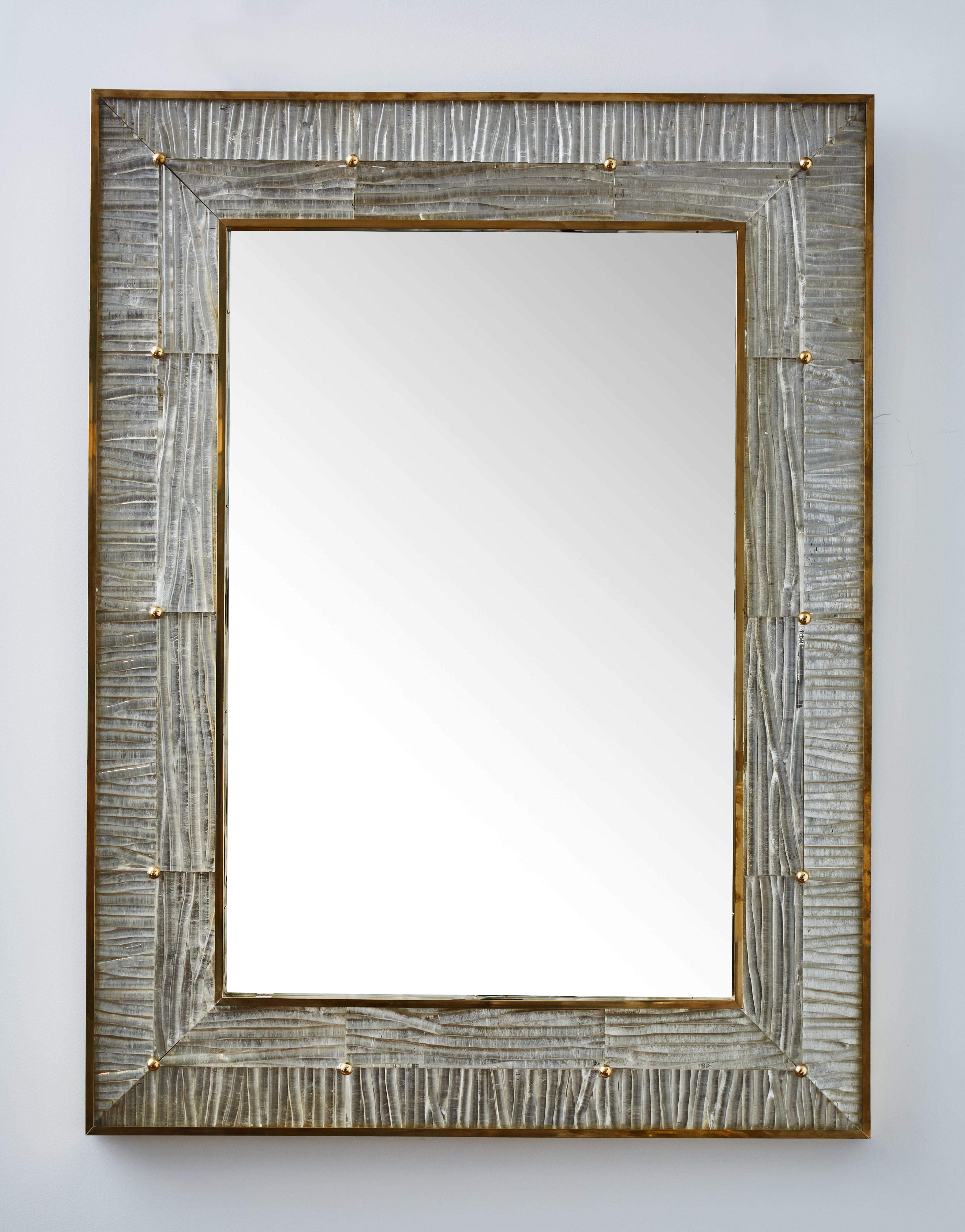 Vintage pair of mirrors with frame in sculpted Murano glass and brass, Italy, 1980s.