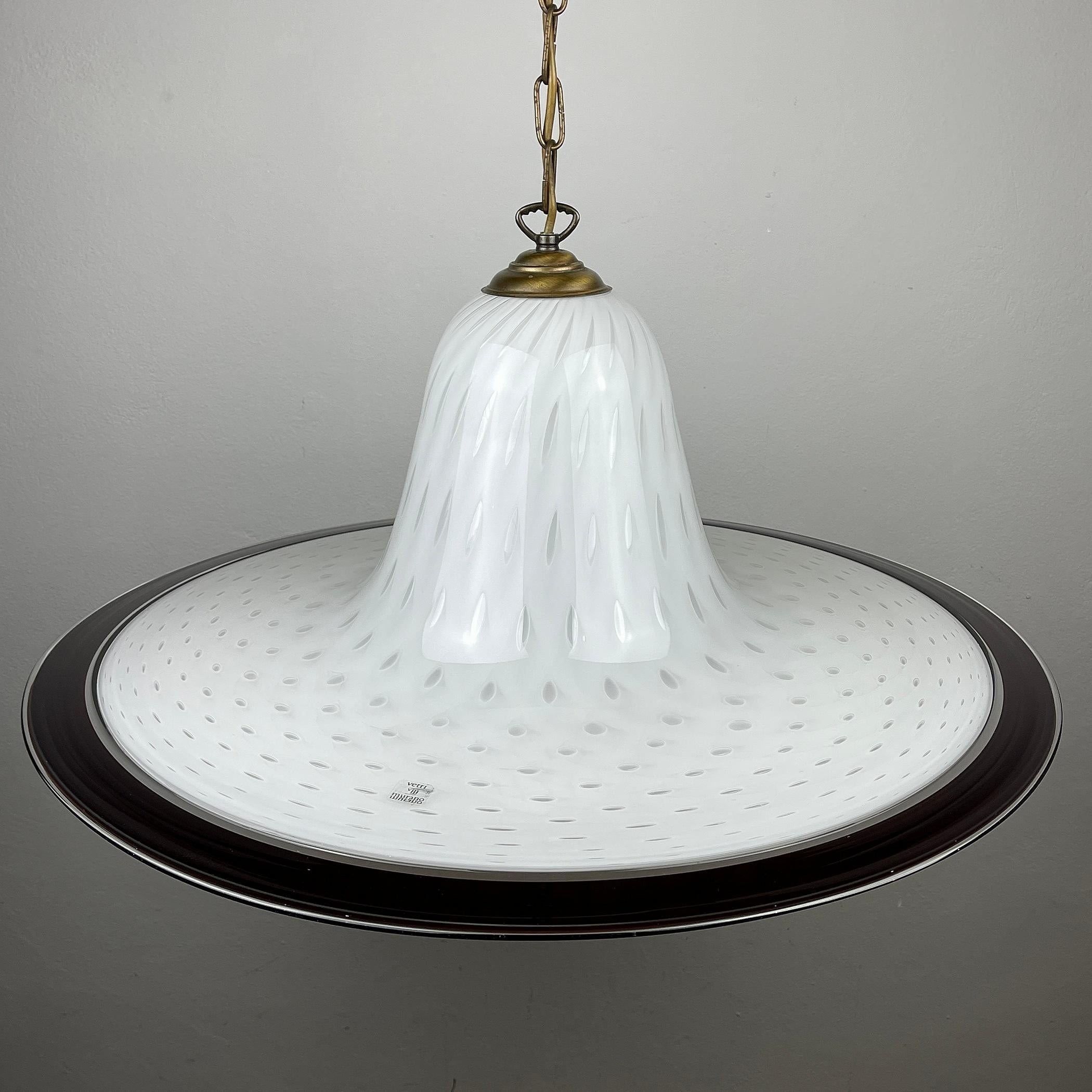 The huge vintage Murano pendant lamp Vetri Murano 025 was made in Italy in the 1970s. Very beautiful white Murano glass with bubbles in the form of a tulip. Perfect vintage condition. No chips or cracks.
Requires a standard Edison E27 with a screw
