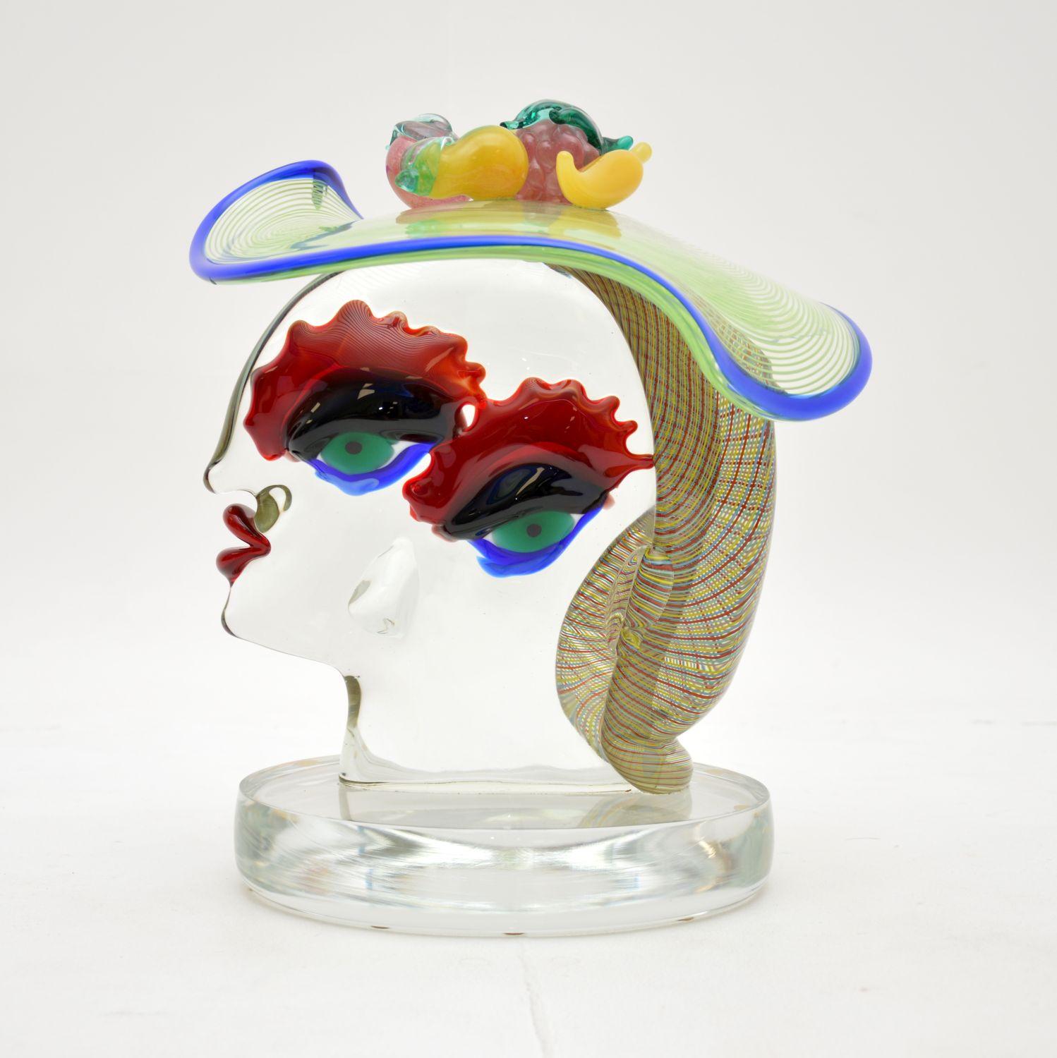 A fantastic Italian Murano glass sculpture, by artist Giuliano Tosi.

This dates from the late twentieth century, it depicts a surrealist bust in the manner of Picasso. It is signed by the artist on base. This has beautiful colours and is of amazing