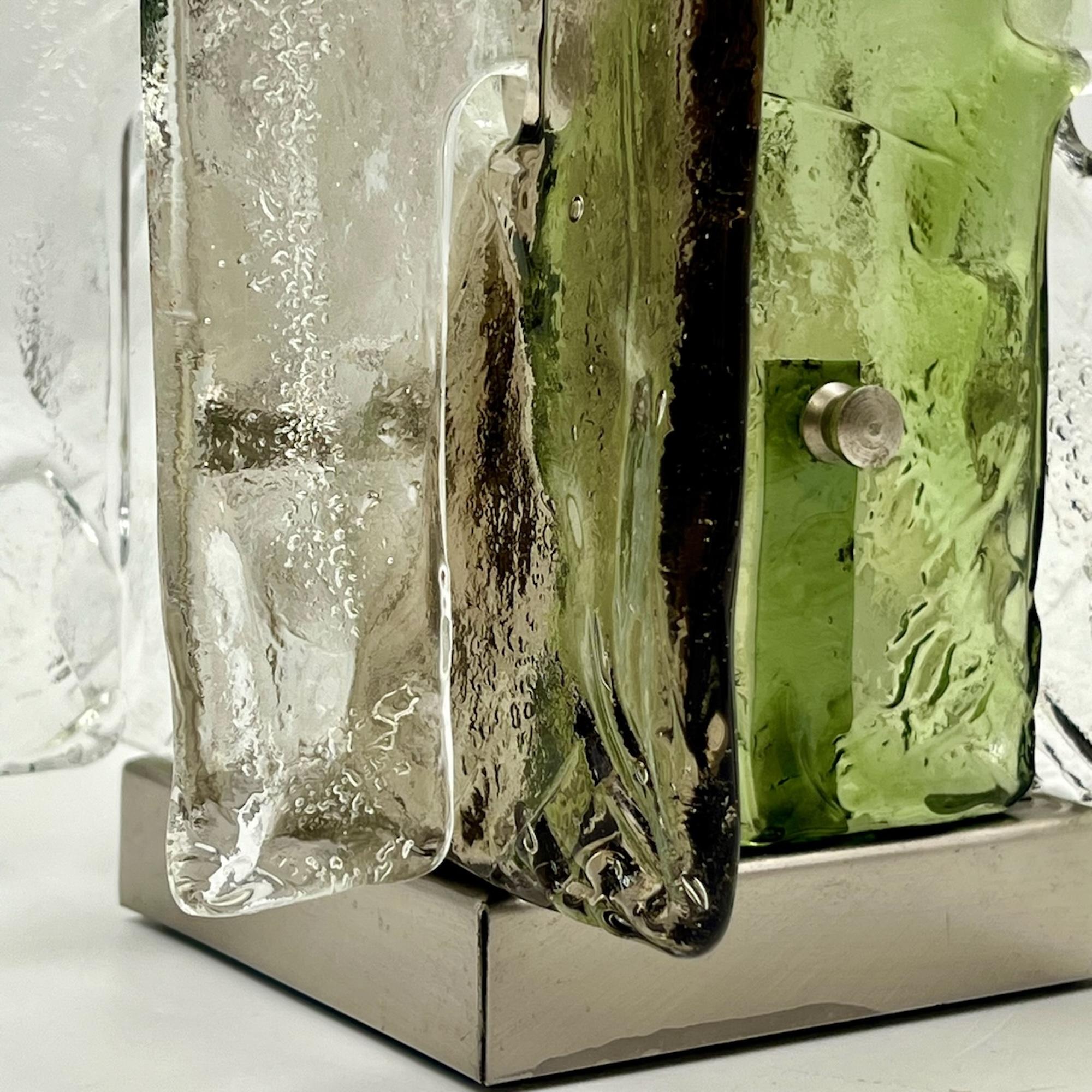 This vintage Murano table lamp, designed by Carlo Nason for Vetrerie Mazzega Murano, represents an iconic mid-century modern design. Featuring hand-blown glass pieces in shades of brown and green, the LT 361 model is a highly collectible example of