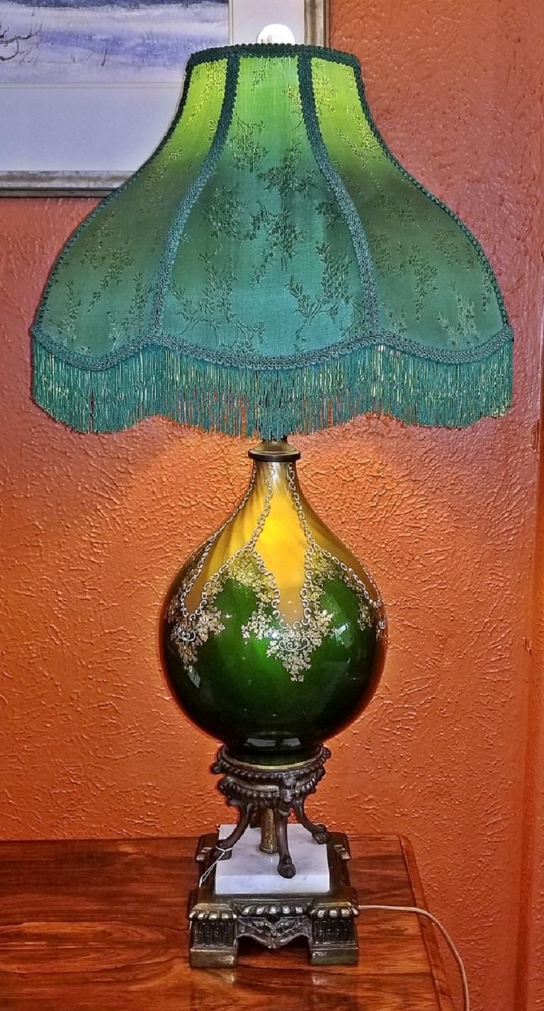 We present to you a beautiful vintage Murano glass table lamp with gold overlay and bronze and marble mounts from circa 1920.

This is a gorgeous lamp!

Despite not being marked or labeled we are confident that this is an Italian Murano glass