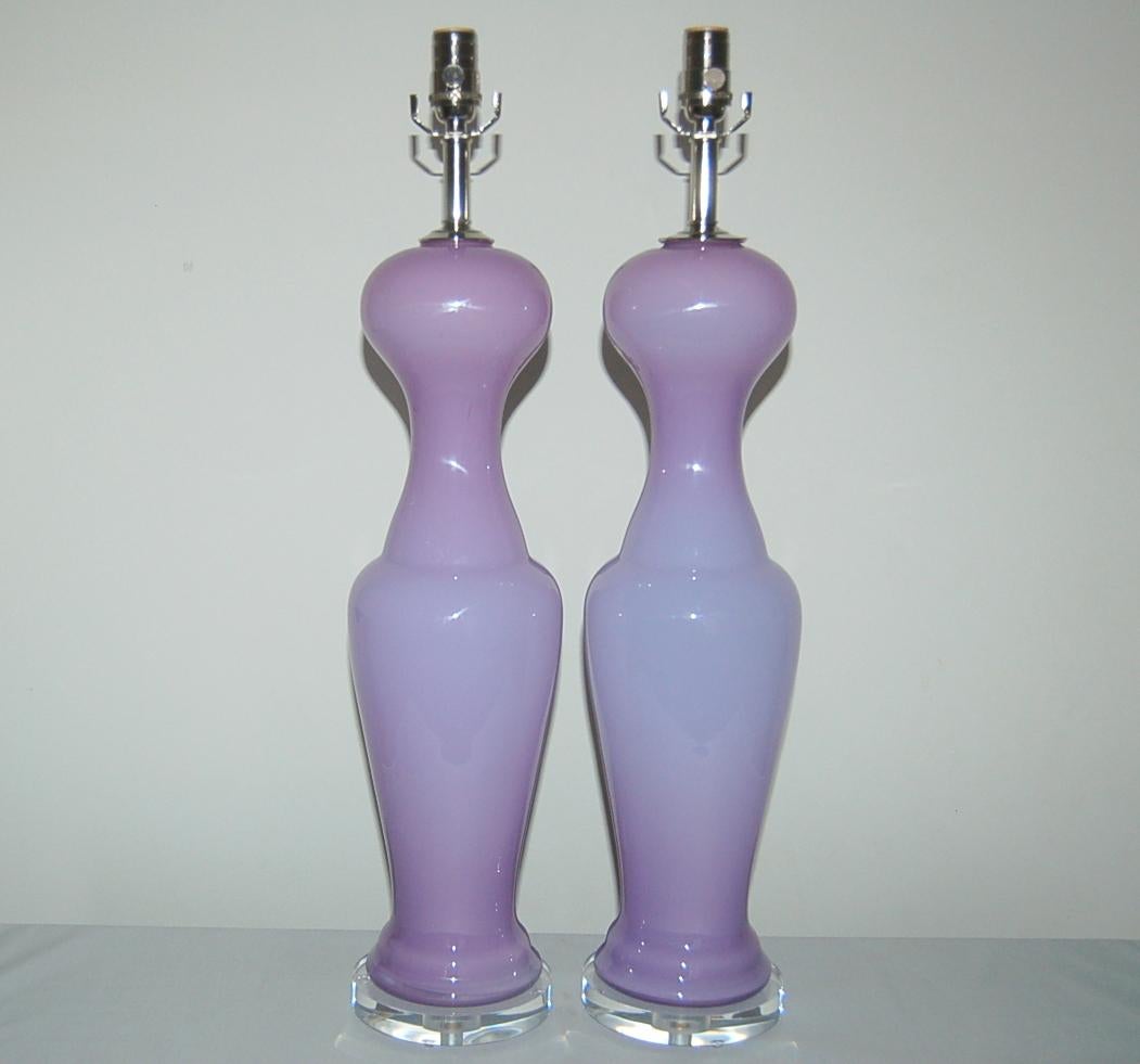 Vintage Murano interpretation of the simple black dress in dreamy LAVENDER. Statuesque and curvy cased Murano glass lamps on Lucite.

These lamps measure 29 inches to the top of the socket. As shown, the top of shade is 35 inches high. Lampshades