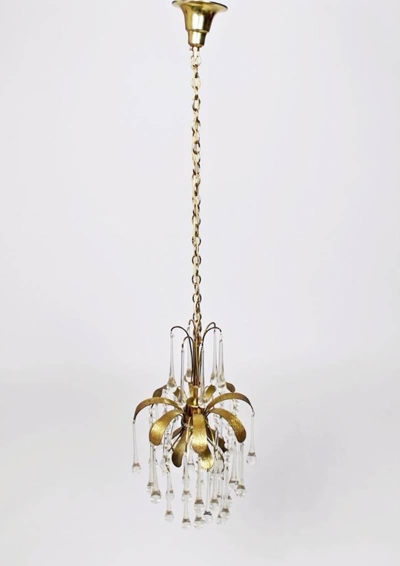 A stunning Pendant light by Palwa (Palme and Walter), Germany, manufactured in 1970s. It’s composed of murano tear drop glass pieces on gilded brass frame with a Brutalist relief.
High quality of materials.
Dimensions :
Diameter :28cm  
Height :110