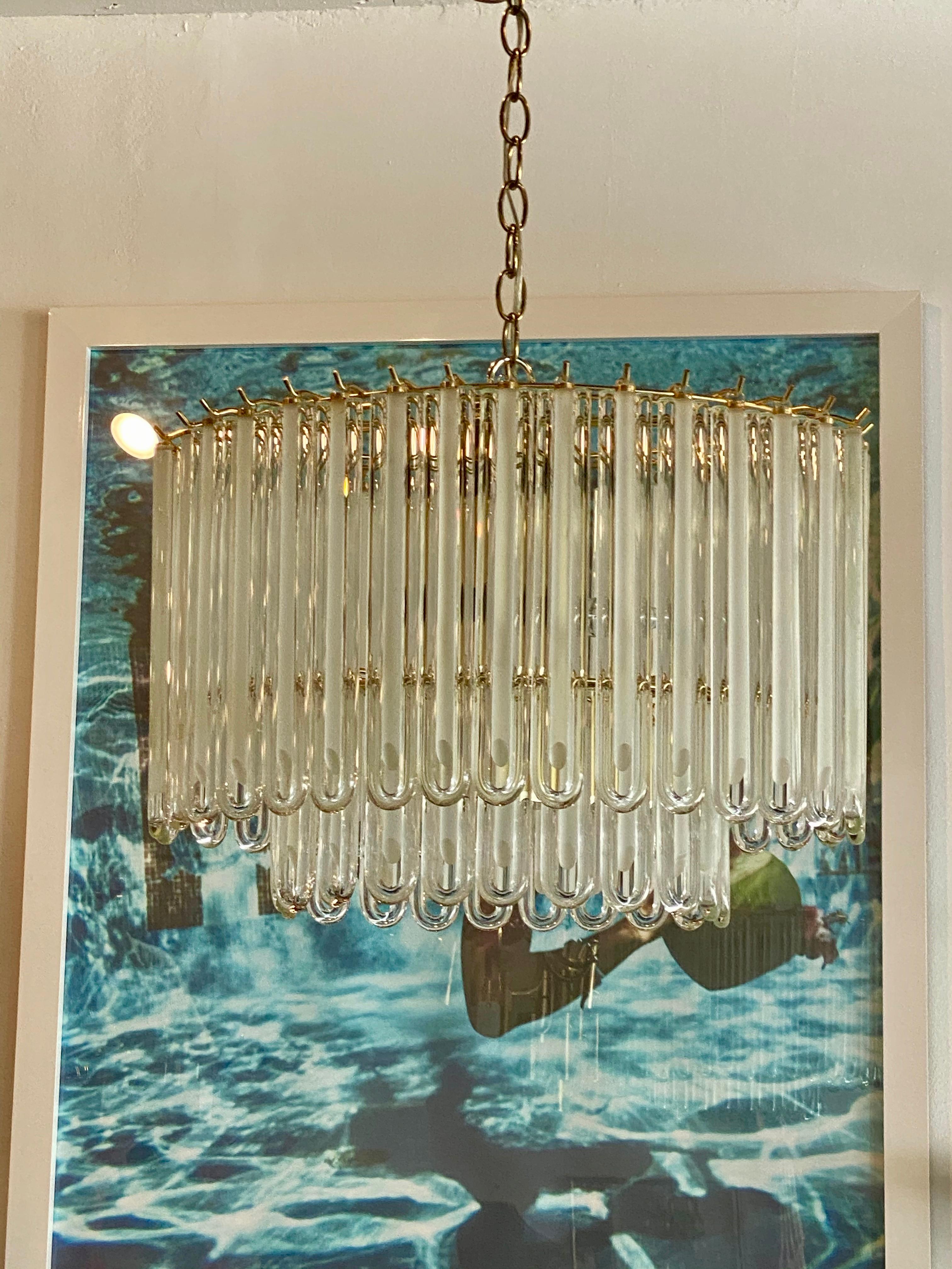 Vintage Murano glass chandelier with brass cage. No broken or chipped pieces of glass. Comes with original brass ceiling canopy.
  