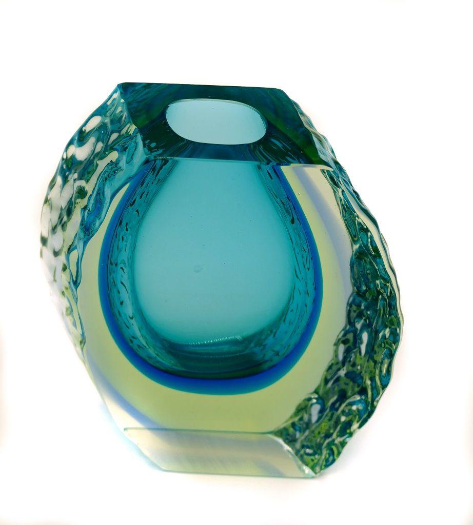 Vintage Murano glass vase is an original Murano decorative object designed by Alessandro Mandruzzato and realized around the mid-20th century.

Made in Italy.

This beautiful turquoise vase, has a really sophisticated shape that can give to your