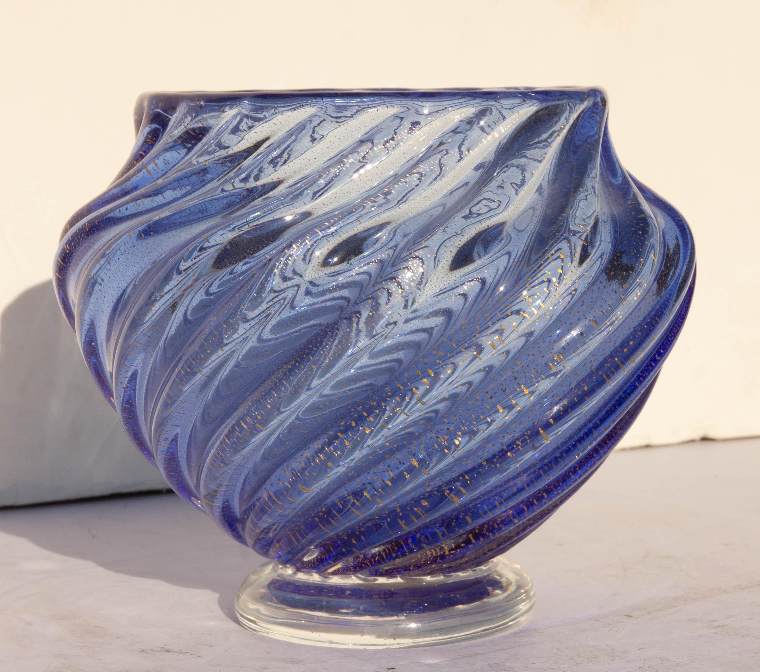 Vintage Venetian glass swirled vase. Blue, and clear glass with gold flecks. Original Murano label on bottom. Mid-20th century.