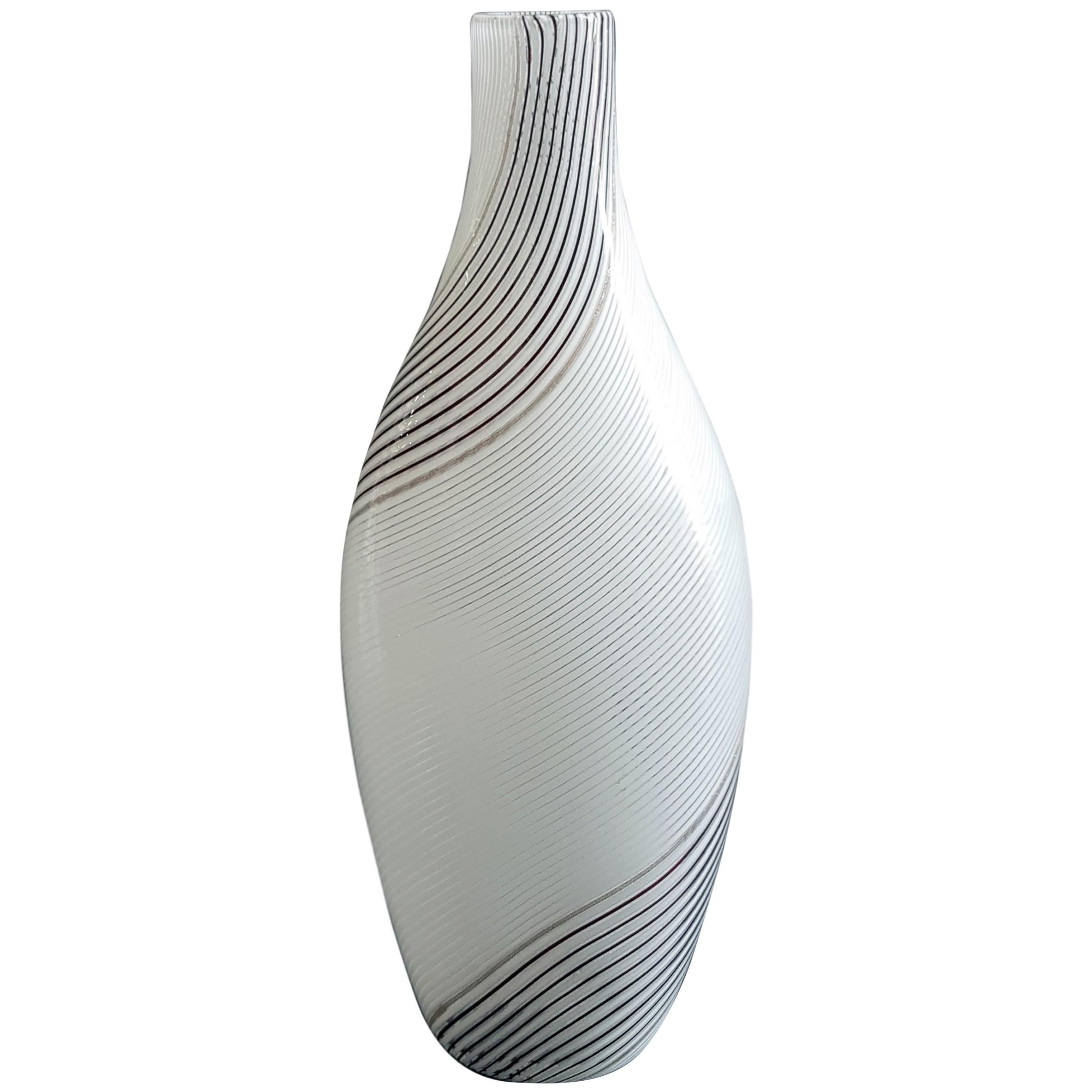 Vase model “5357” by Italian Murano designers Dino Martens and Aureliano Toso.

Vintage and rare vase with re-twisted pipes, aventurine and amethyst, handle applied with vitreous paste and gold.

Bibliography: 
- Marc Heiremans, Dino Martens,