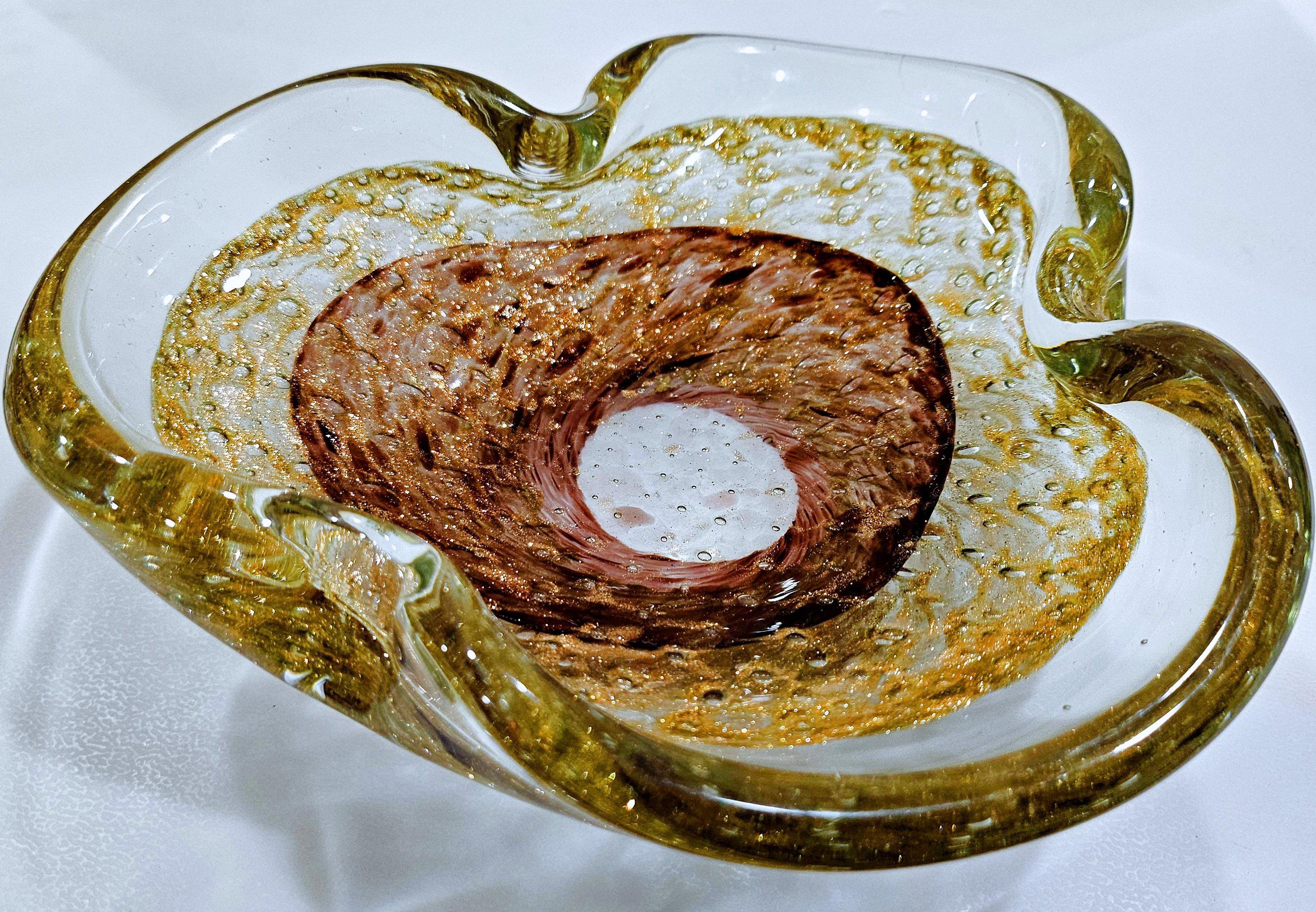 Vintage Murano Glass Ashtray/Dish, Bullicante (controlled bubbles) & Aventurine
If you like shimmer, you'll love this piece with its generous aventurine, inside which is a nice, subtle pattern of controlled bubbles.
Measures: approximately 7 x 2 