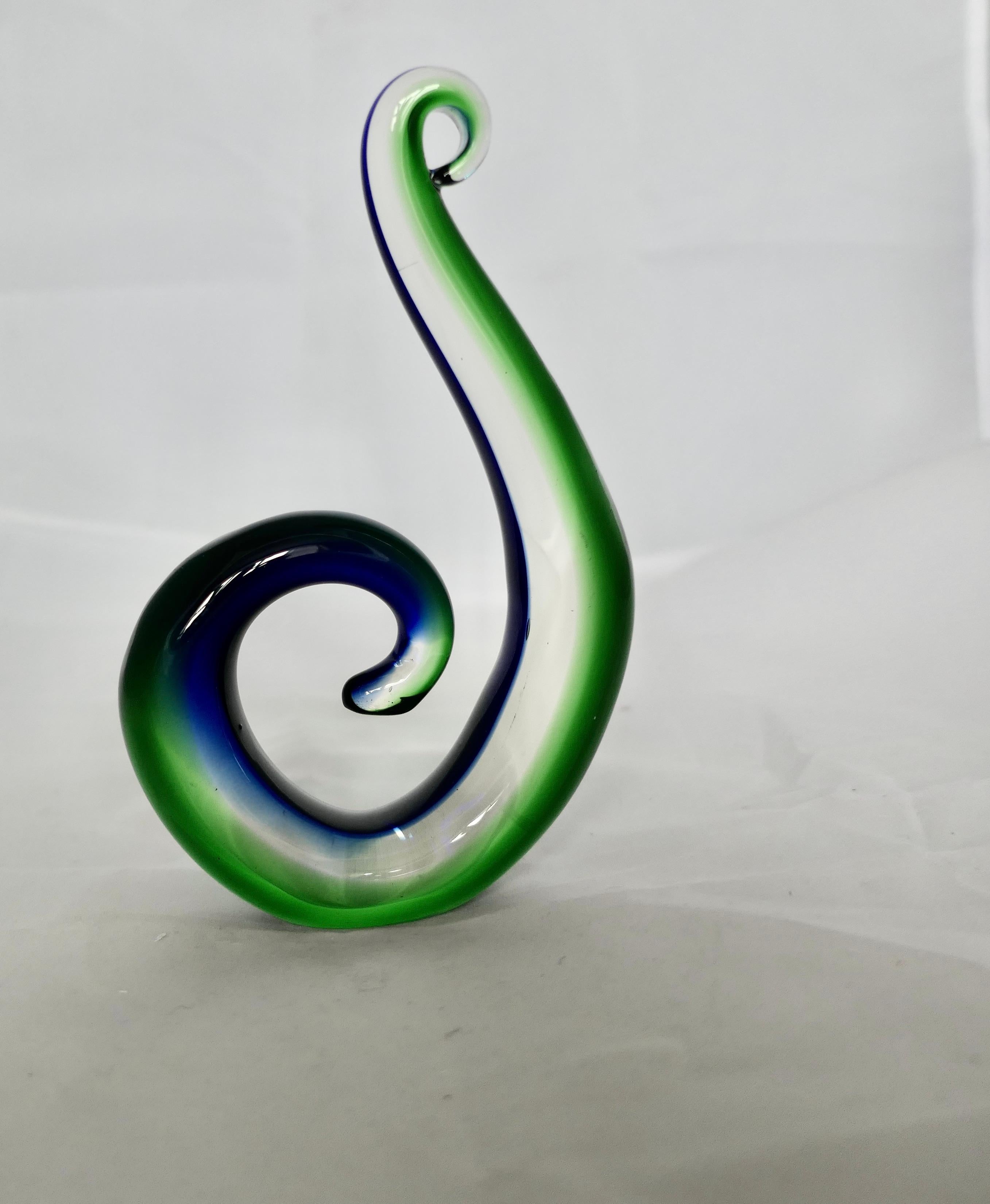 Vintage Murano Hand Crafted Green and Blue Koru

Representing a Fern Frond uncurling the Koru is a representation of the New beginning
The piece is 7” tall, 4.5” wide and 1.5” deep
FB220