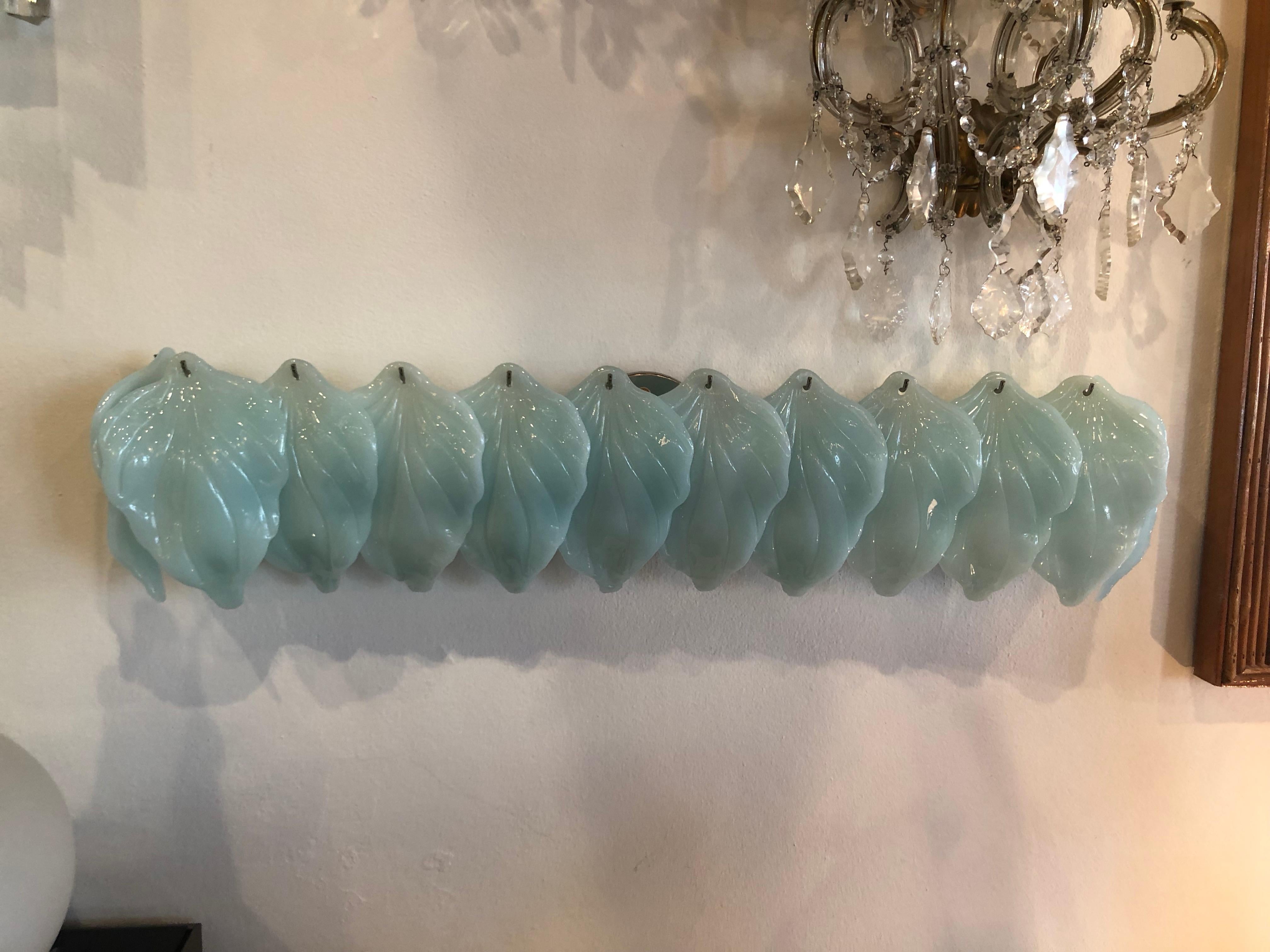 Amazing, very unique, vintage Murano Mazzega aqua blue glass leaves wall light lamp vanity sconce. 12 large leaves with no breaks or chips. Murano label present on chrome cage. Holds 4 lightbulbs.