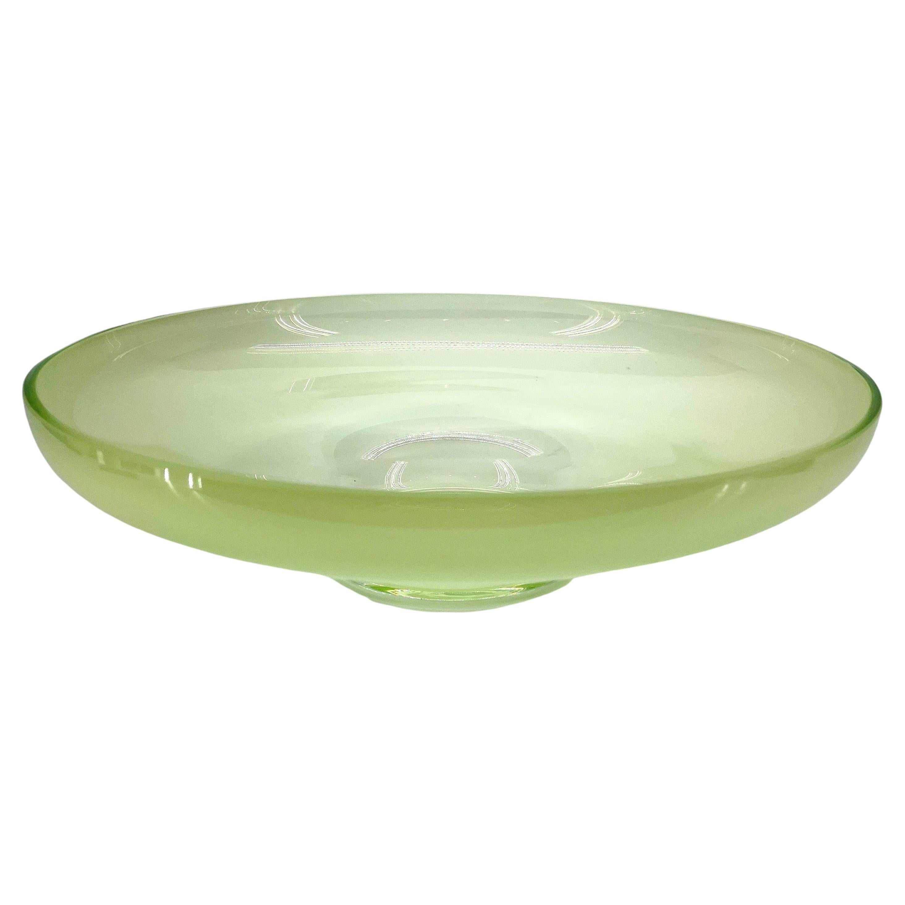 Green Opaline Murano Glass Centerpiece Bowl 

This very sturdy centerpiece bowl is both decorative as well as functional. The wear and tear to the base is un-beatble. This classic vintage bowl is a perfect statement piece in any formal or informal