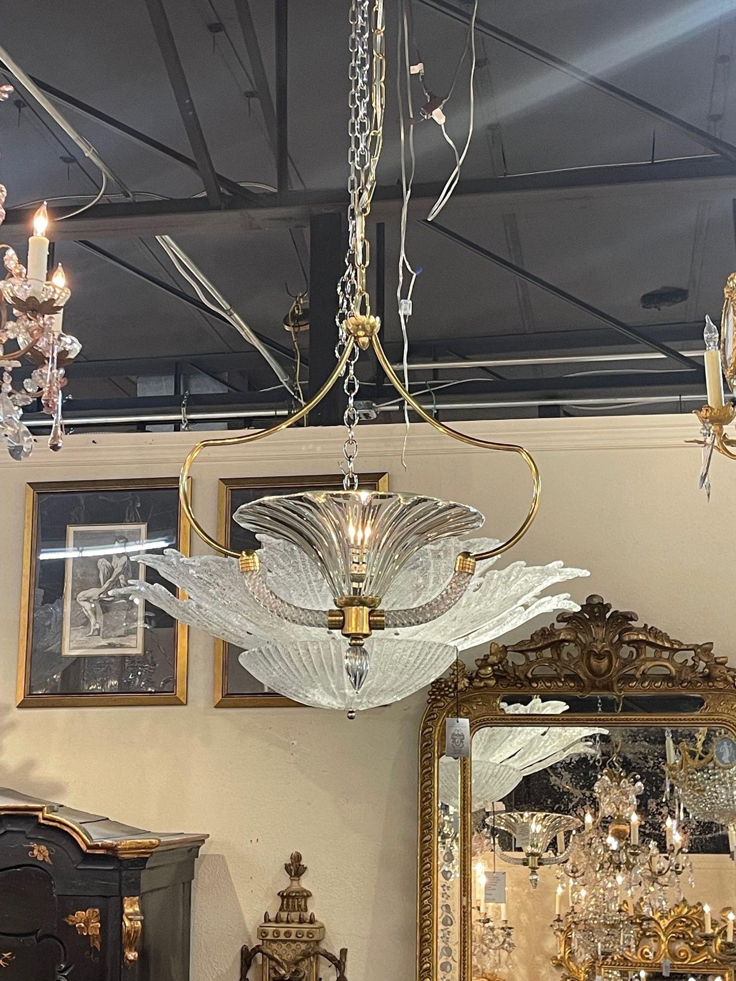 Vintage Murano glass and brass pendant light after barovier and Toso. Circa 1960. Perfect for today's transitional designs! 
The pendant has been professionally re-wired, cleaned and is ready to hang. Includes matching chain and canopy.