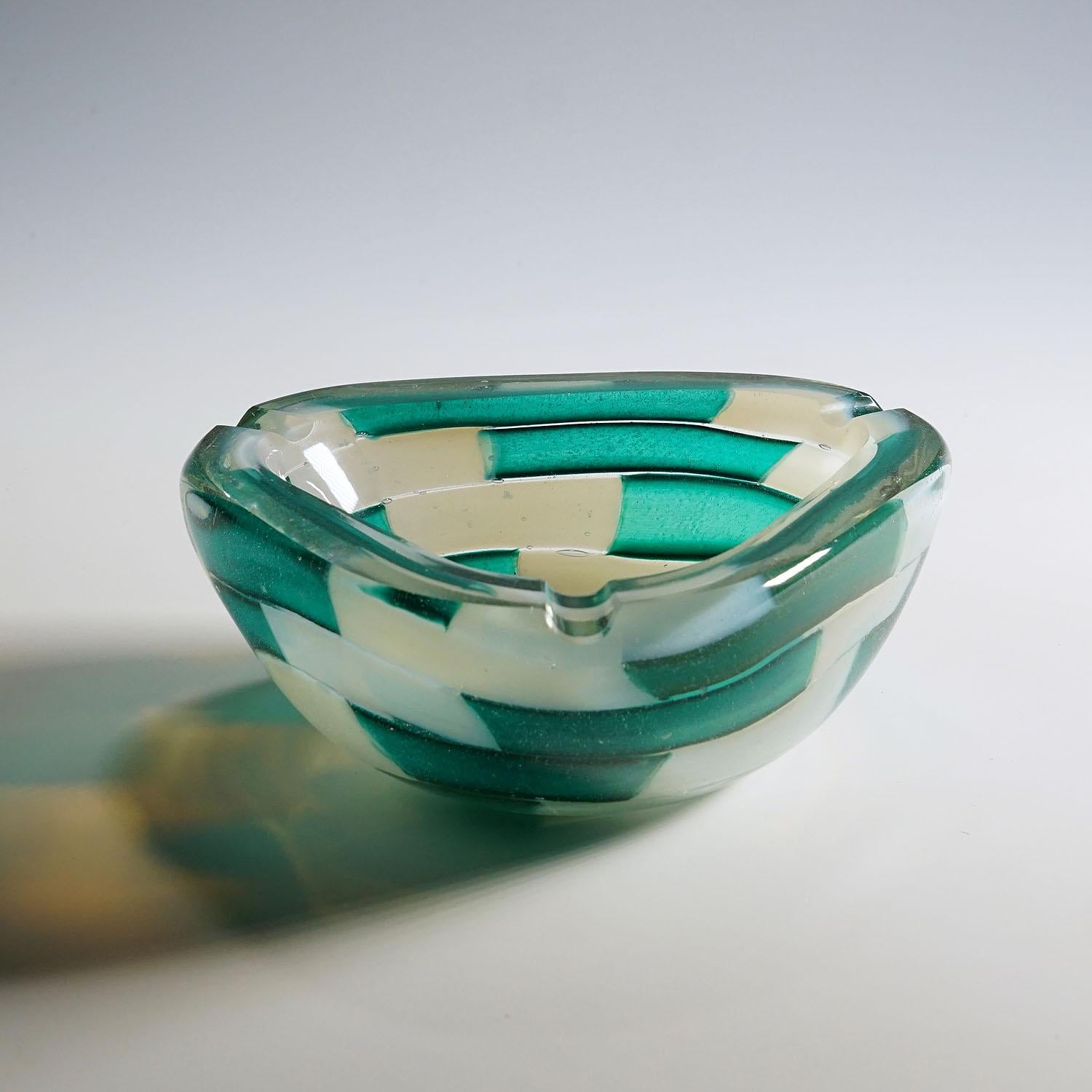 Vintage Murano Pezzato Art Glass Ashtray by Barovier & Toso 1950s

A heavy Murano art glass ashtray designed by Ercole Barovier and manufactured by Barovier & Toso, Italy circa 1950s. Heavy hot moulded glass internally decorated with opaline and