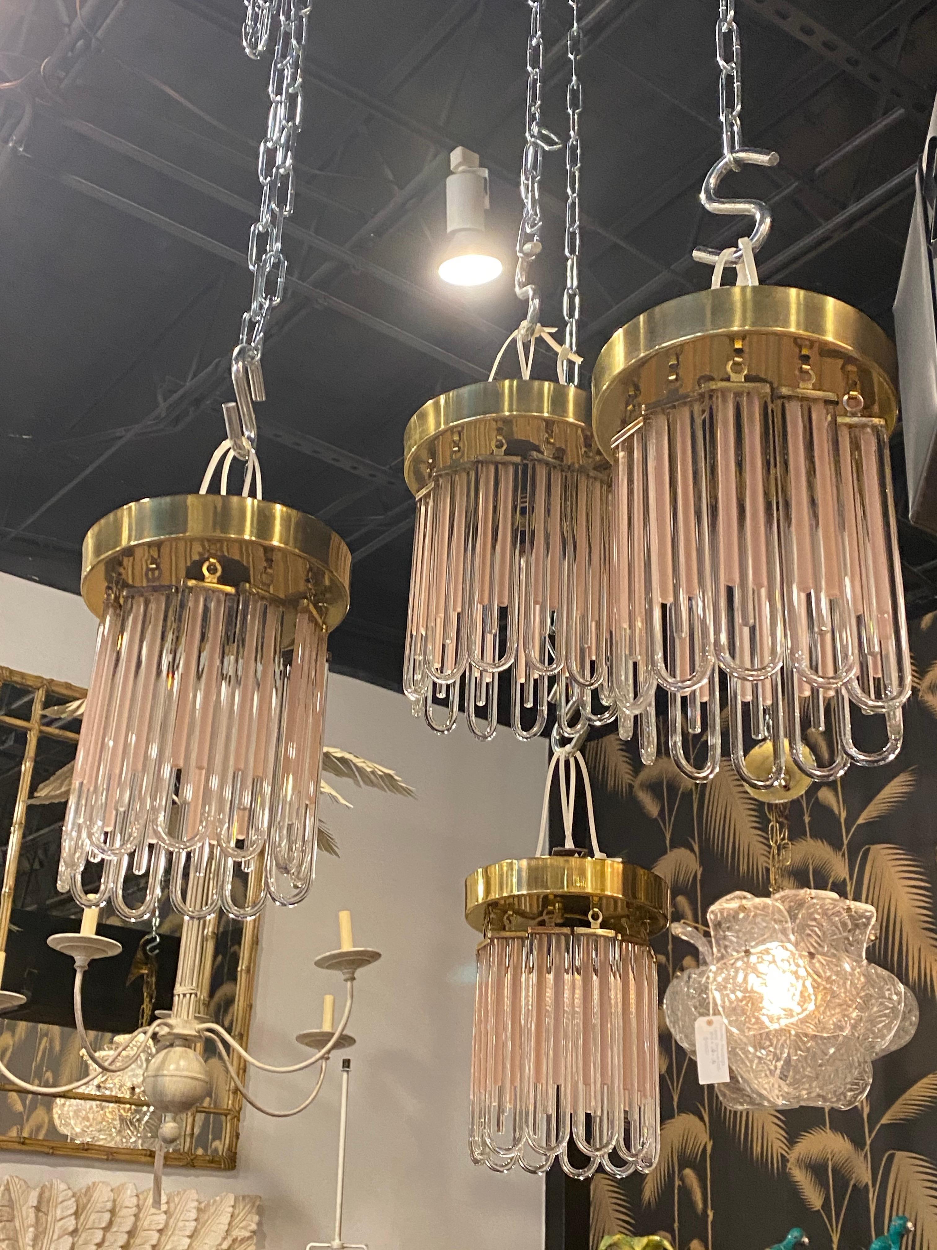 Lovely vintage 1960s Murano, flush mount chandelier. Brass Top with clear glass and pink u shape drops. Mounts to ceiling. Please note 3 have sold and currently there is only 1 available. Great powder room, hall, 
closets, light. The aliasing is for