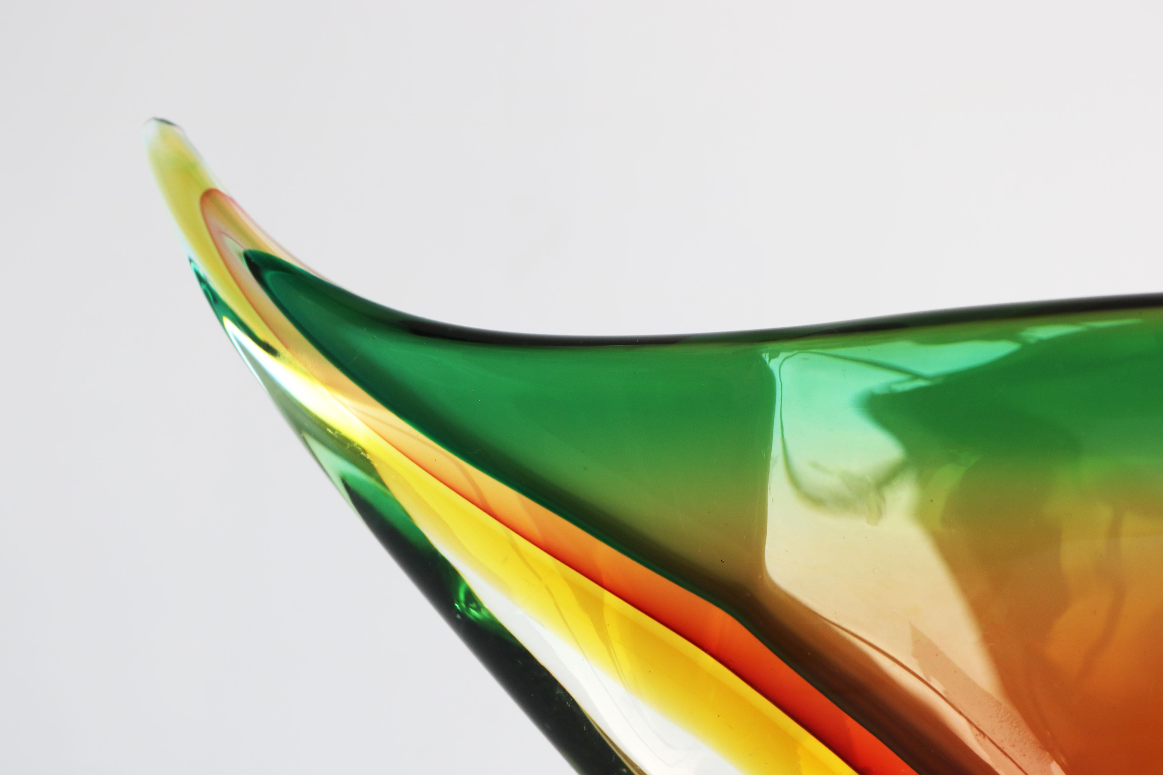 Gorgeous & Timeless! This freefrom vase by Flavio Poli for Seguso italy 1960. Made fully by hand using the Sommerso technique. Capturing multiple layers of colour between clear glass and then carved out. Very nice piece with 3/4 colours captured