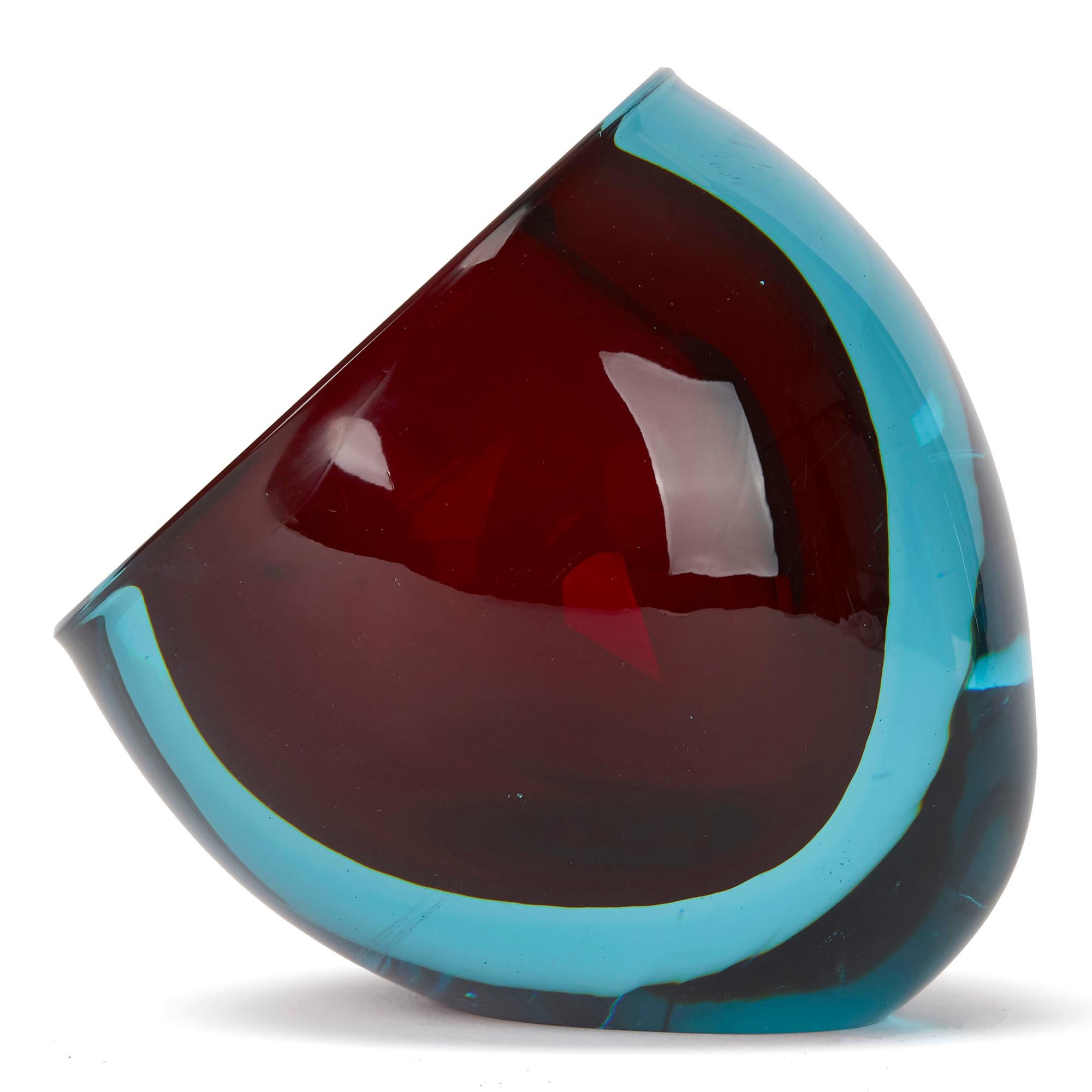 PLEASE NOTE: This piece is currently located in our Amsterdam office, please enquire for delivery times. 

A stylish vintage Italian Murano art glass bowl or ashtray in red with blue cased Sommerso style, the rounded bowl standing on an angled foot
