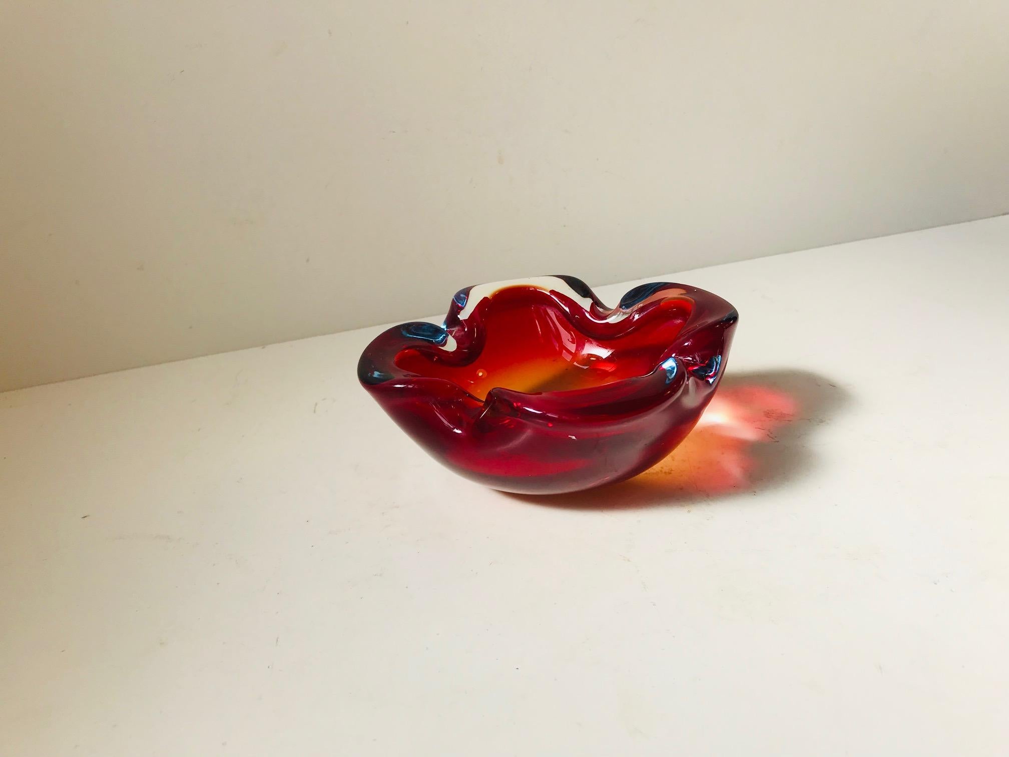 Heavy and thick decorative small bowl or ashtray composed of multicolored Sommerso glass. Designed by Flavio Poli and manufactured at Seguso in Murano Italy during the 1960s.