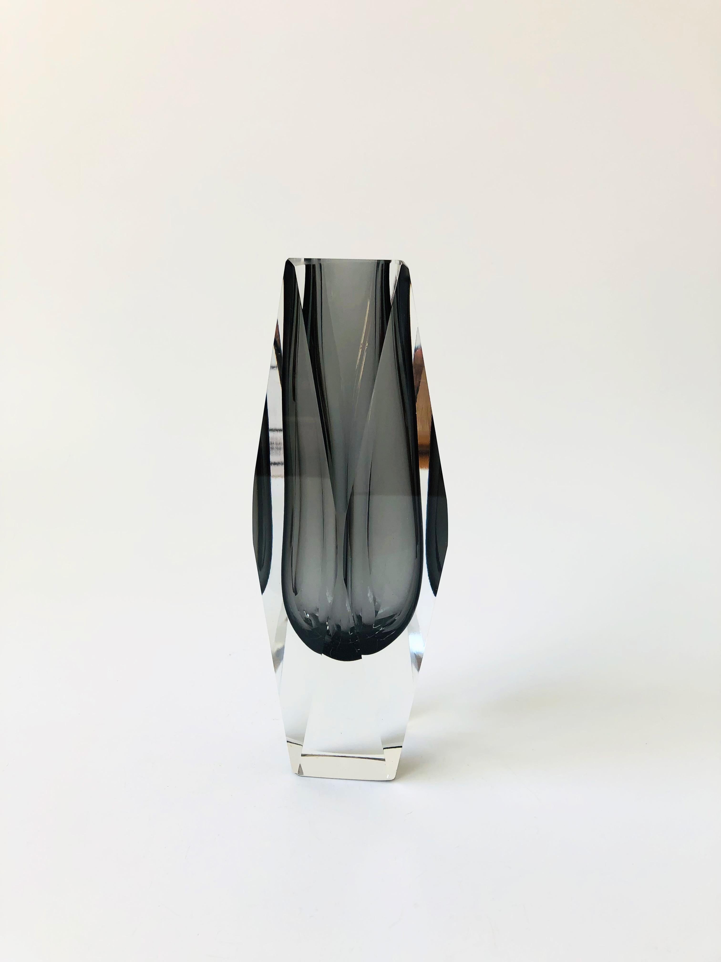 A beautiful 1970s vintage Italian art glass vase. Beautiful sommerso technique of gray glass encased in a faceted clear outer glass. Designed by Alessandro Mandruzzato for Murano.
 