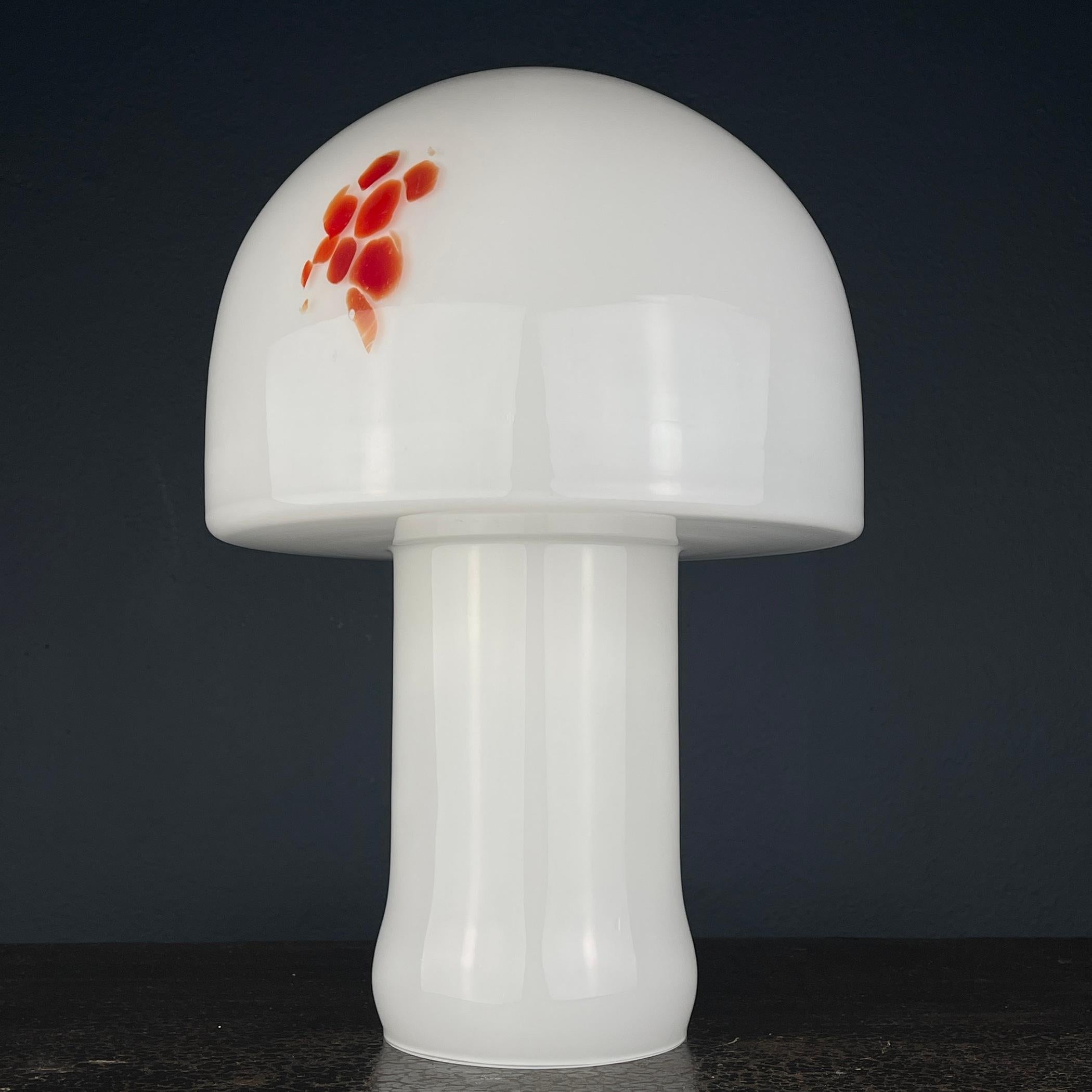 Step into the glamour of the 1970s with this exquisite Murano mushroom lamp, a true Italian classic. Crafted in Italy, this lamp is a flawless example of both art and design. In excellent condition, it has stood the test of time without any damage.