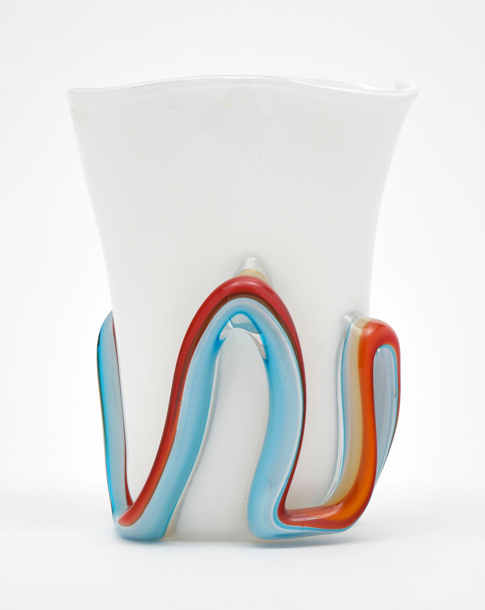 Vase from the island of Murano signed by Cenedese. This organic piece is made with white glass and a bicolor swirl all around. We love the movement of this hand-blown piece!
