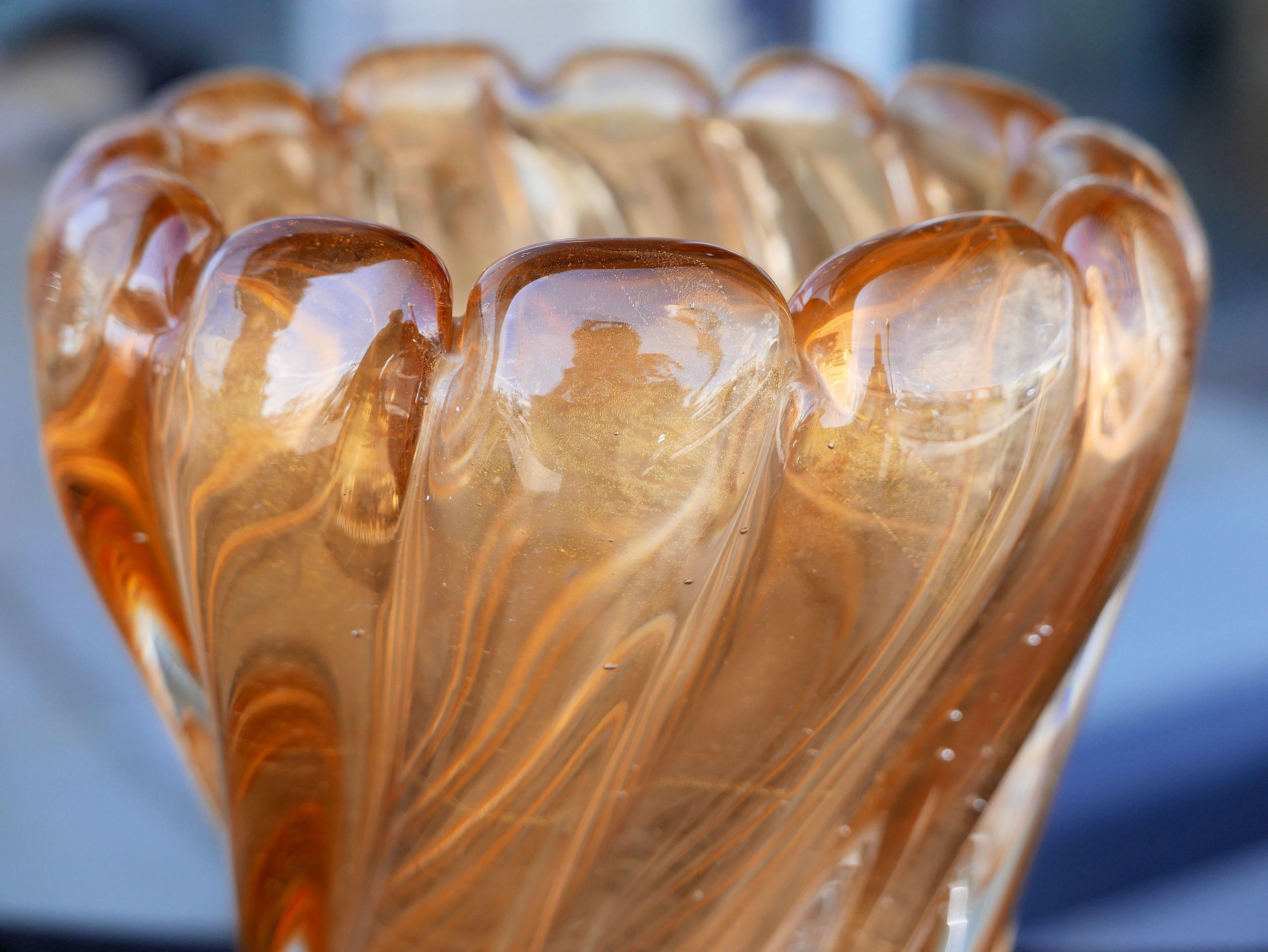 Beautiful swirled Murano glass with gold inclusions in a color I like to think of as candied apricot by Seguso, circa 1950.