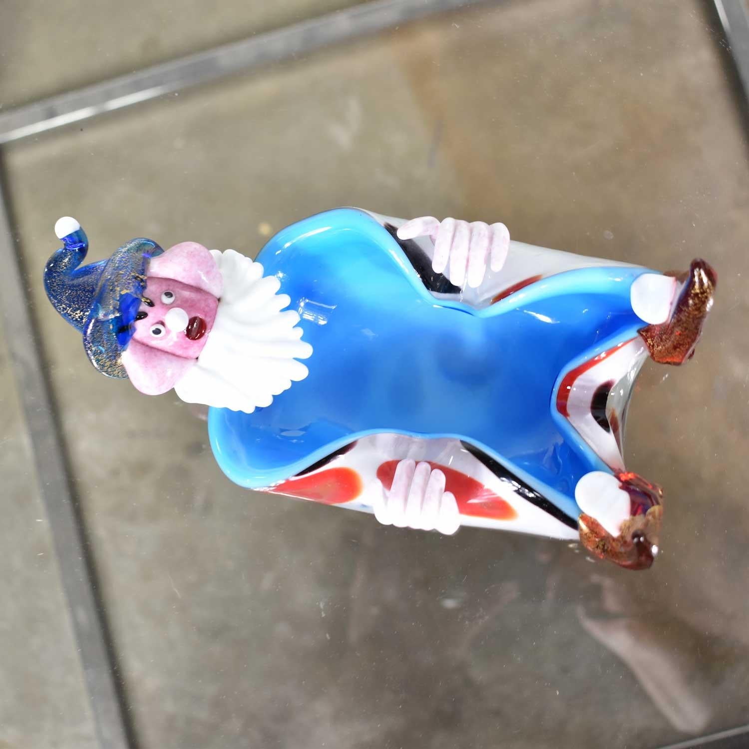 Awesome example of Mid-Century Modern vintage Murano Venetian glass in this adorable clown dish. It is in excellent condition with no chips, cracks, or chiggers. It does have a very worn maker’s sticker on its bottom that is not readable. There are