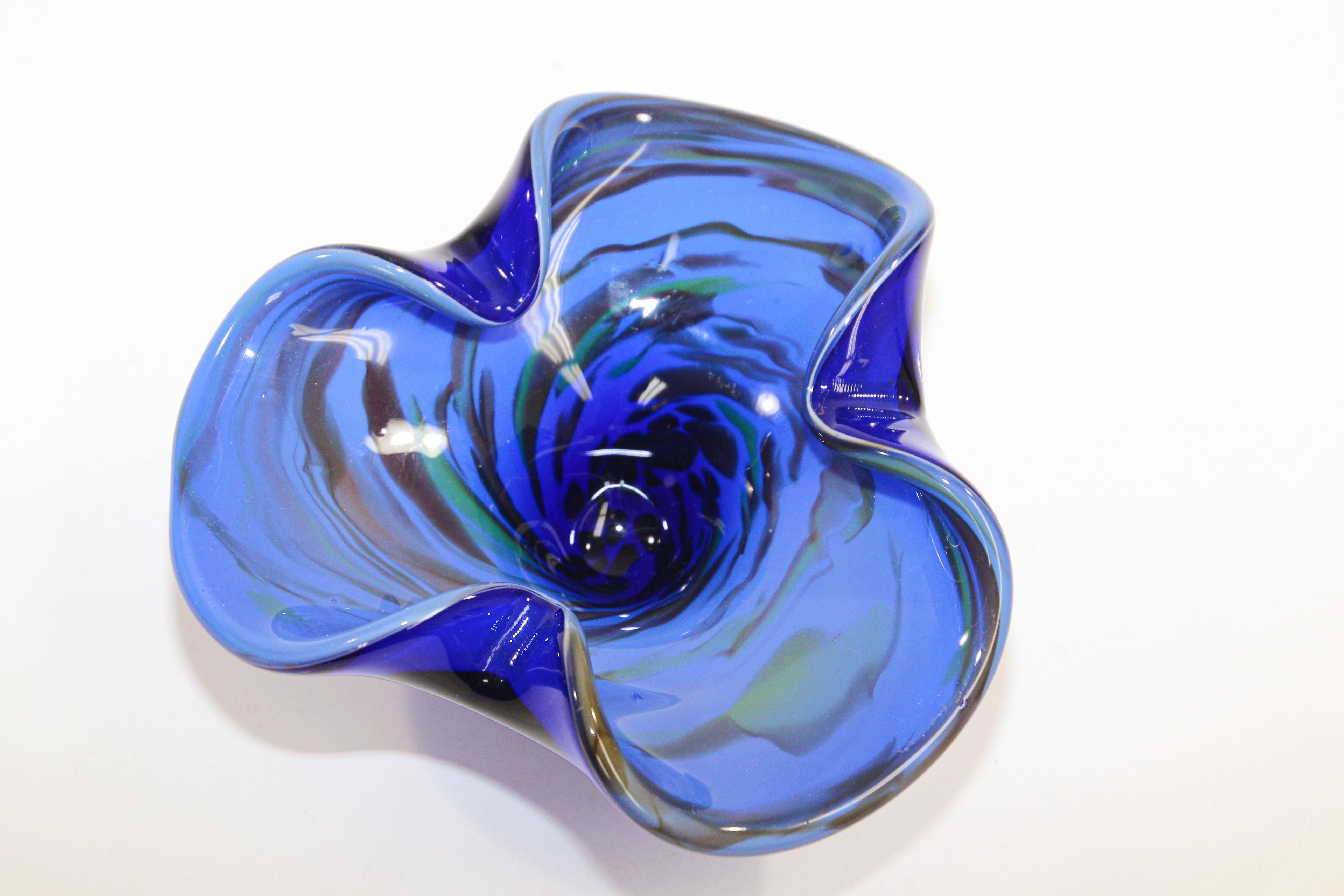 Gorgeous Vintage Murano Venetian handblown art glass flower shaped bowl or ashtray. 
Sculptural organic open flower form in cobalt blue art glass ashtray bowl.
Use it as an ashtray, vide poche or for decorative bowl or paper weight.
no