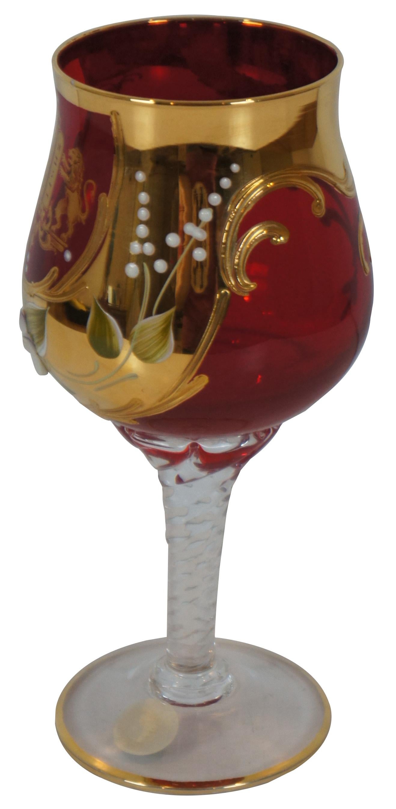Vintage hand blown Murano art glass kiddush cup, with twisted stem and ruby glass top gilded and decorated with a pair of lions flanking the tablets of the Ten Commandments, above a hand painted porcelain flower.
 