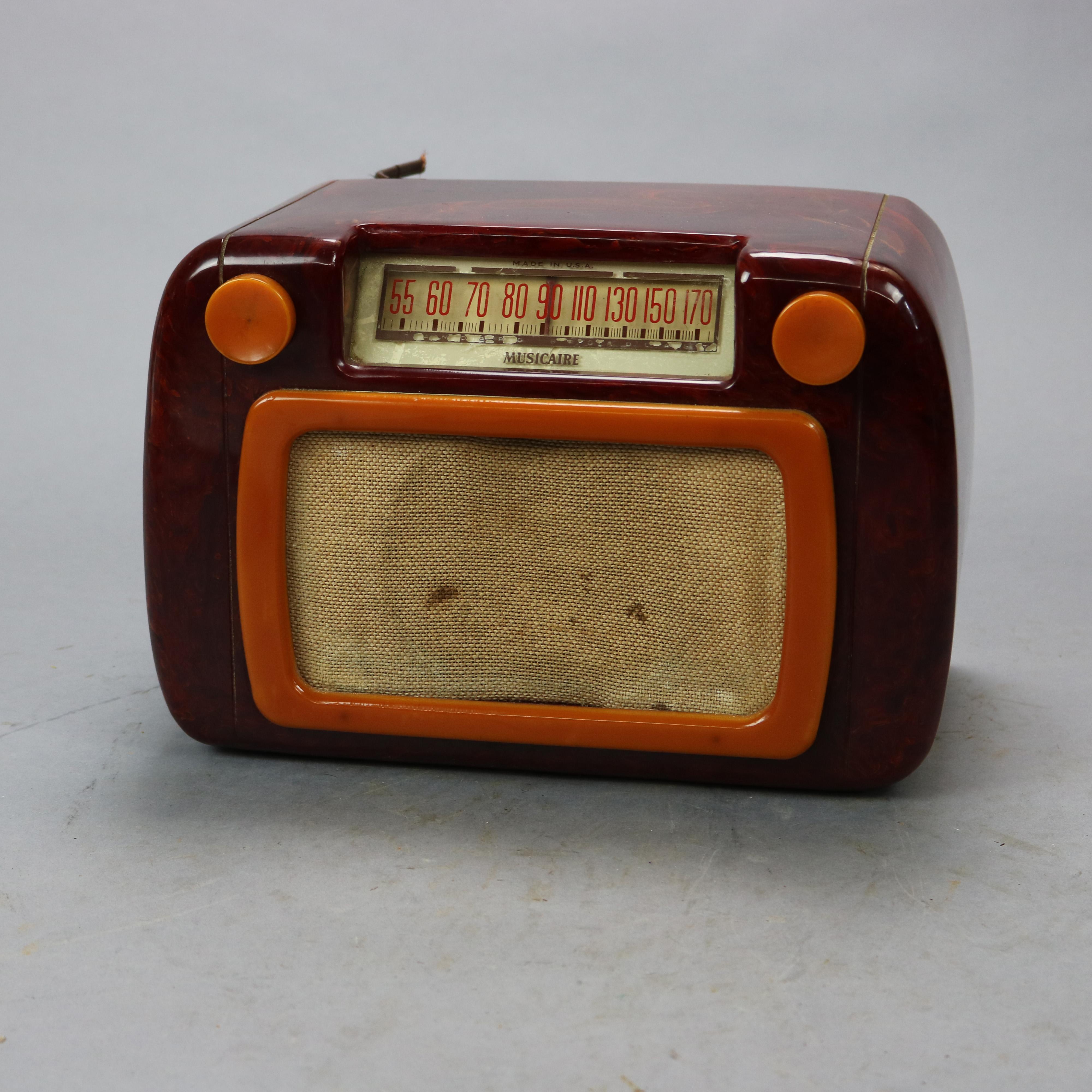 Vintage Musicaire Catalin Butterscotch & Burgundy Bakelite Radio Circa 1940

Measures - 7.5''h x 11''w x 6.75''d.
 