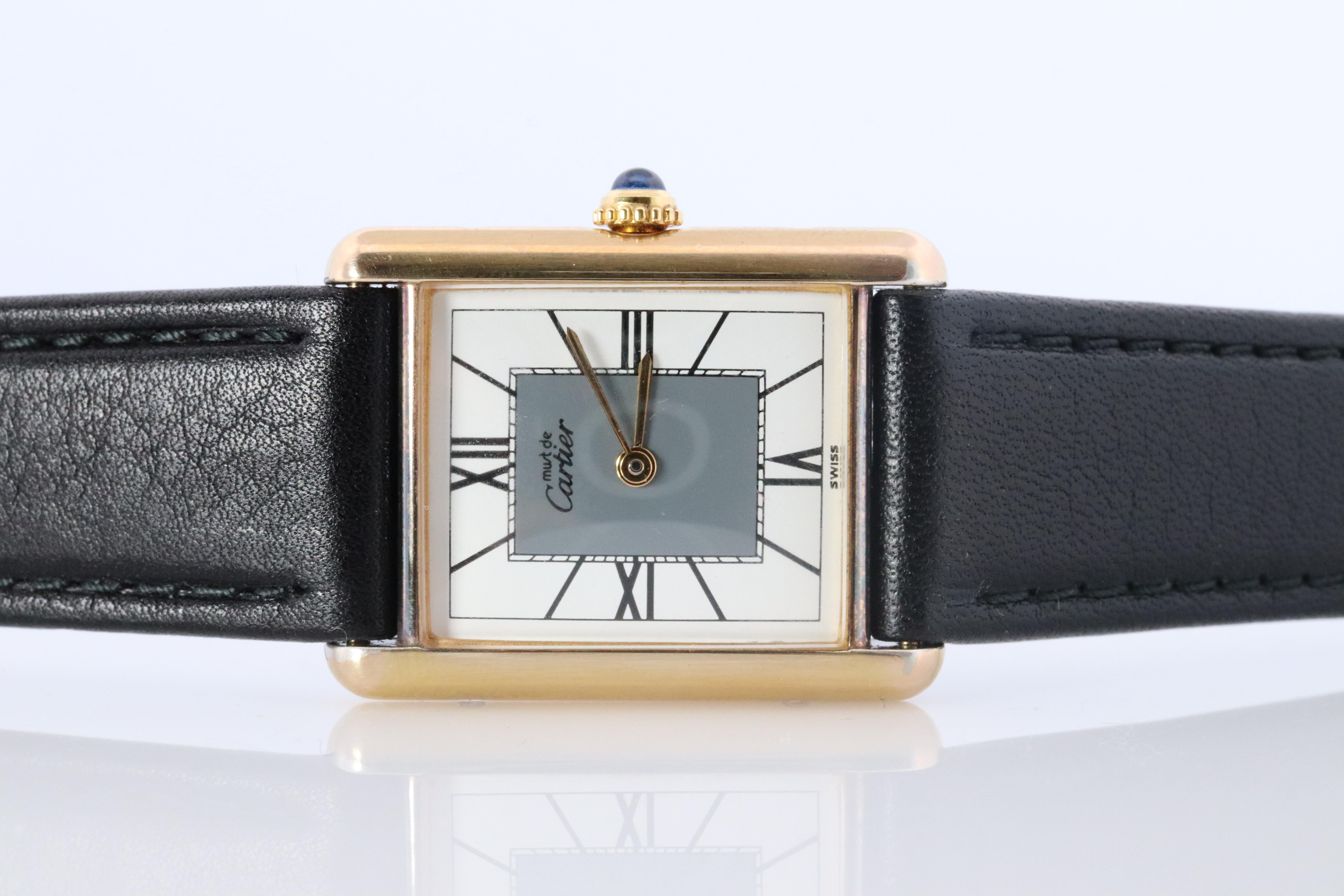 Genuine Cartier watch. Vintage Iconic Tank Argent. Sterling Silver and Gold plated (Vermeil).

ref.590005

Comes with a new GUCCI leather band

Rare Gray and White Dial with Quartz movement .
New battery replaced.


Condition: Excellent